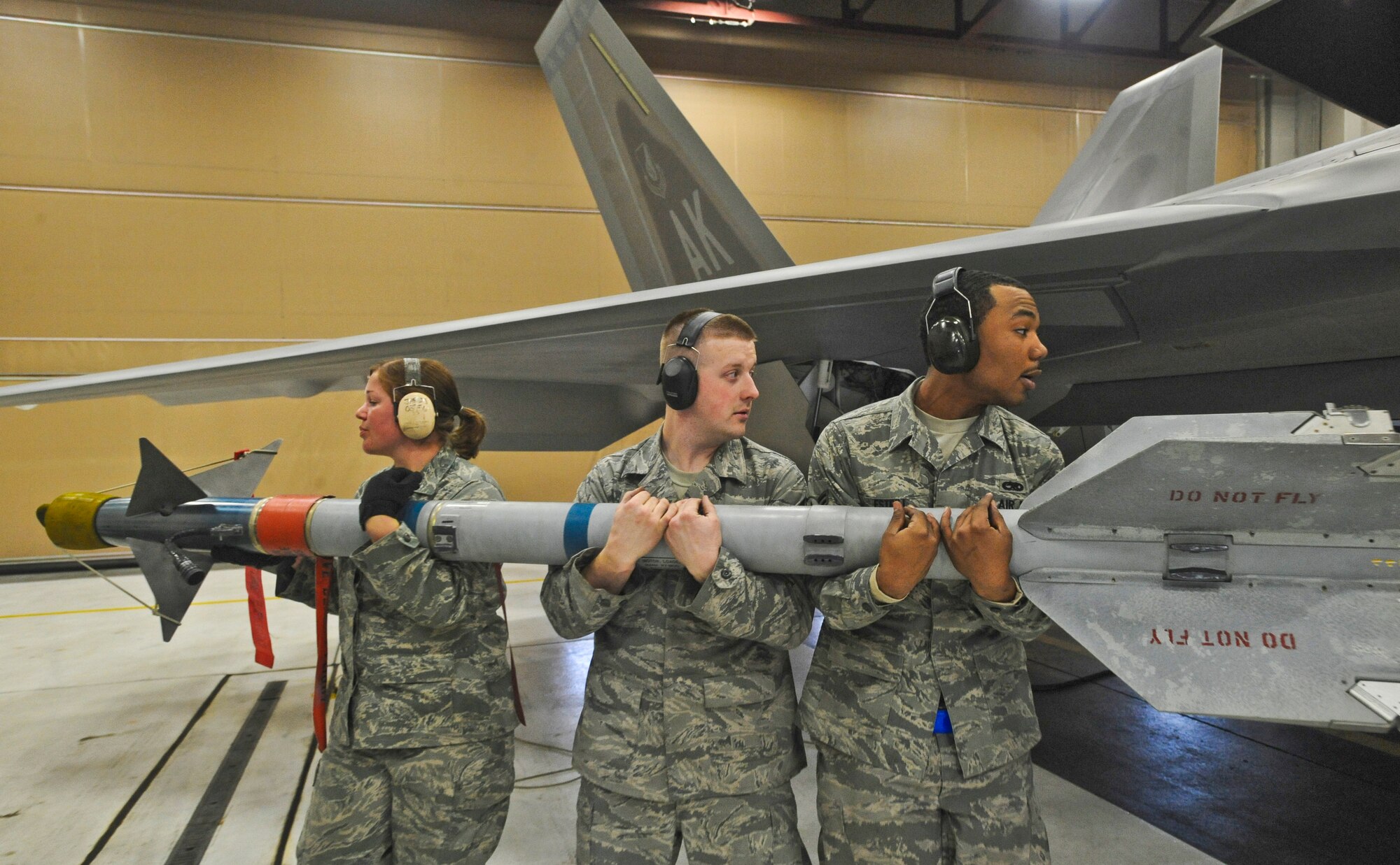 ELMENDORF AIR FORCE BASE, Alaska -- Staff Sgt. Jason Leighton, 90th Aircraft Maintenance Unit (center), prepares to load a missile onto a F-22 with his crew during a load crew inspection March 11, 2009. Leighton is a 2009 Lt. Gen. Leo Marquez Award winner in the Munitions/Missile Technician Supervisor Category. The Marquez Award is one of the hightest honors for a maintainer at Air Force level. (U.S. Air Force photo/ Senior Airman Matthew Owens)