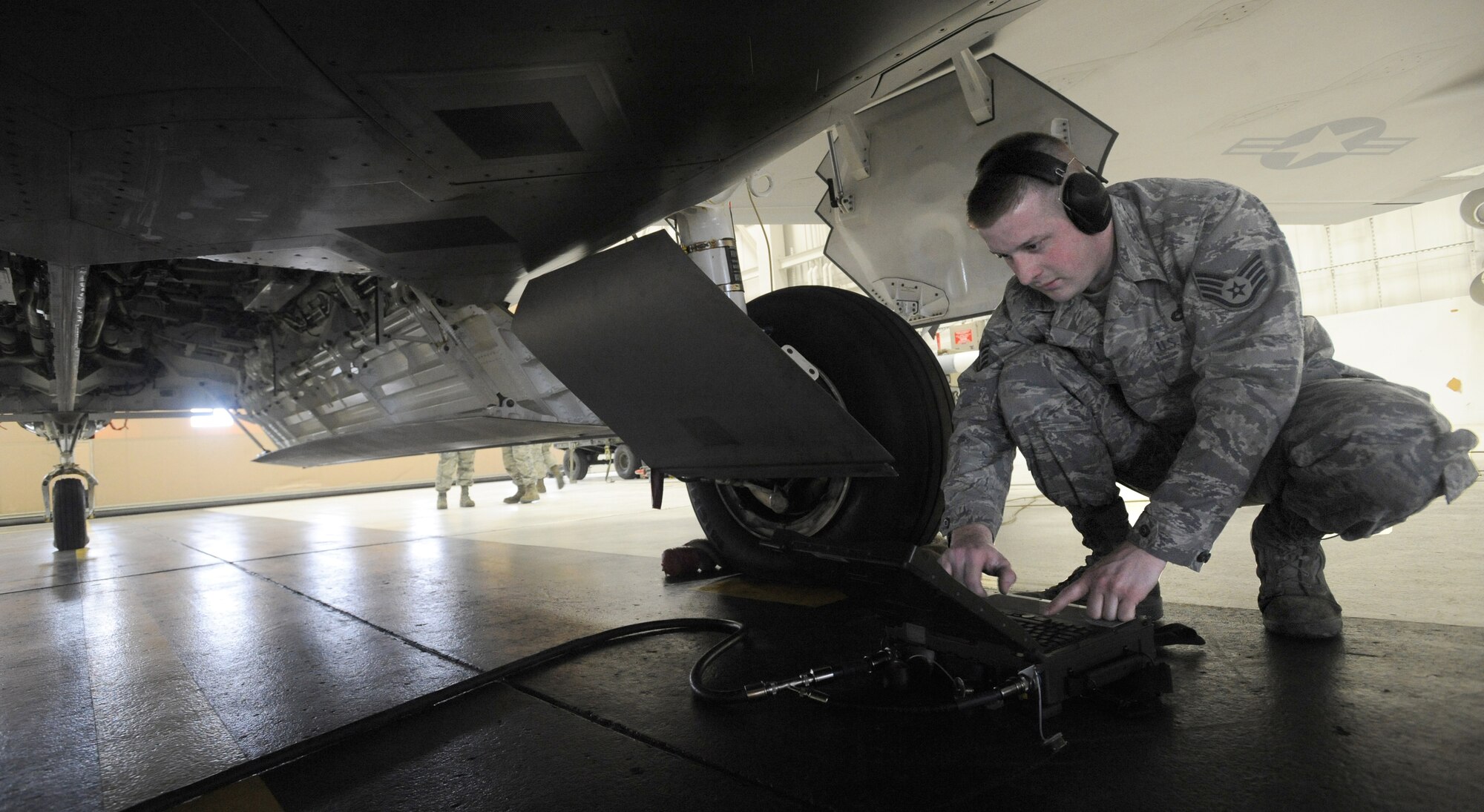 ELMENDORF AIR FORCE BASE, Alaska -- Staff Sgt. Jason Leighton, 90th Aircraft Maintenance Unit, runs diagnostics on a F-22 during a load crew inspection March 11, 2009. Leighton is a 2009 Lt. Gen. Leo Marquez Award winner in the Munitions/Missile Technician Supervisor Category. The Marquez Award is one of the hightest honors for a maintainer at Air Force level. (U.S. Air Force photo/Senior Airman Matthew Owens)