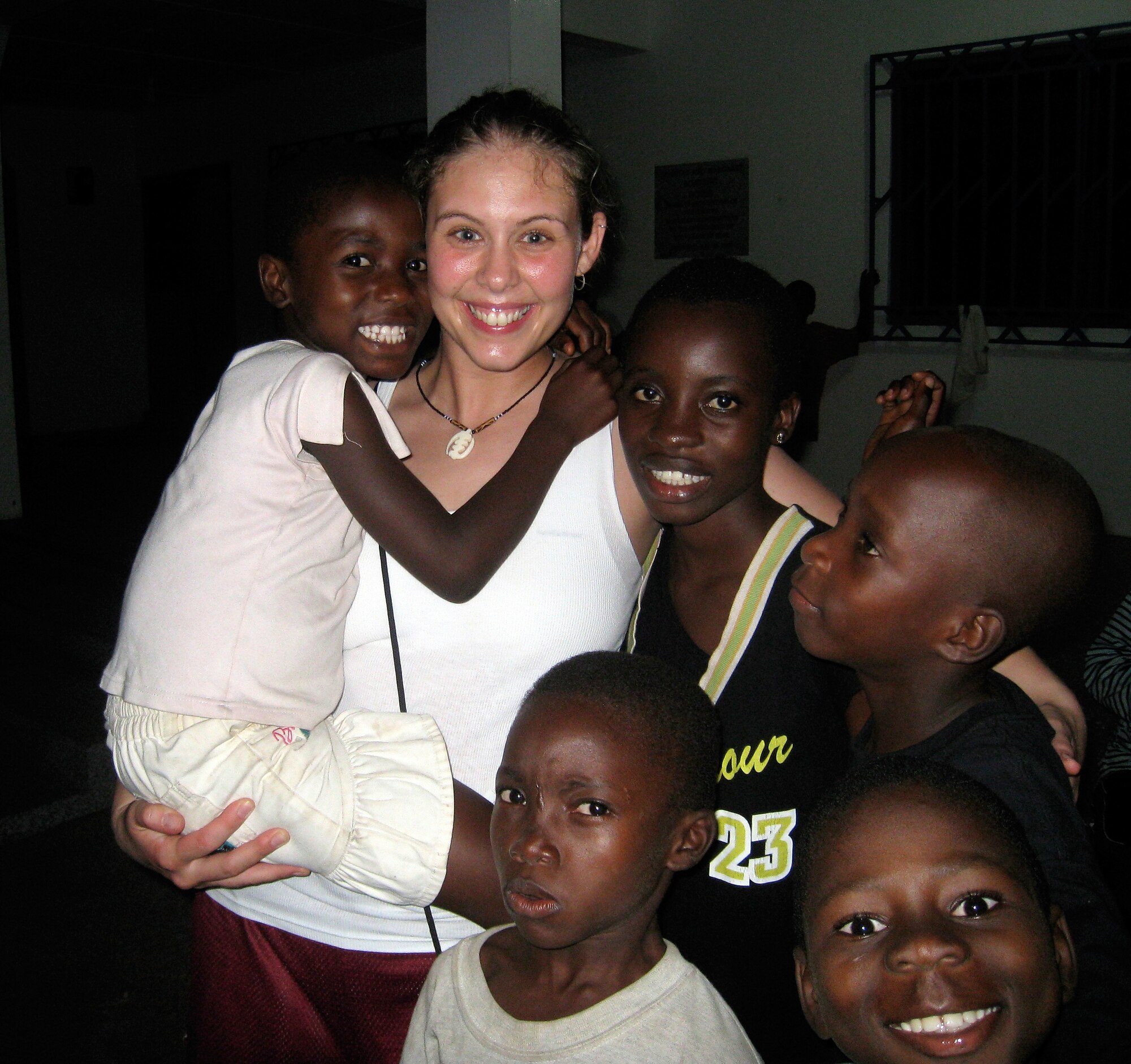 Staff Sgt. Andrea Mosca, medical technician, 59th Medical Inpatient Squadron, visits with children at the Village of Hope in West Ghana, Africa, in December 2008. Sergeant Mosca recently volunteered her own time and paid to make the trip to provide medical assistance to the orphanage. (Courtesy photo) 