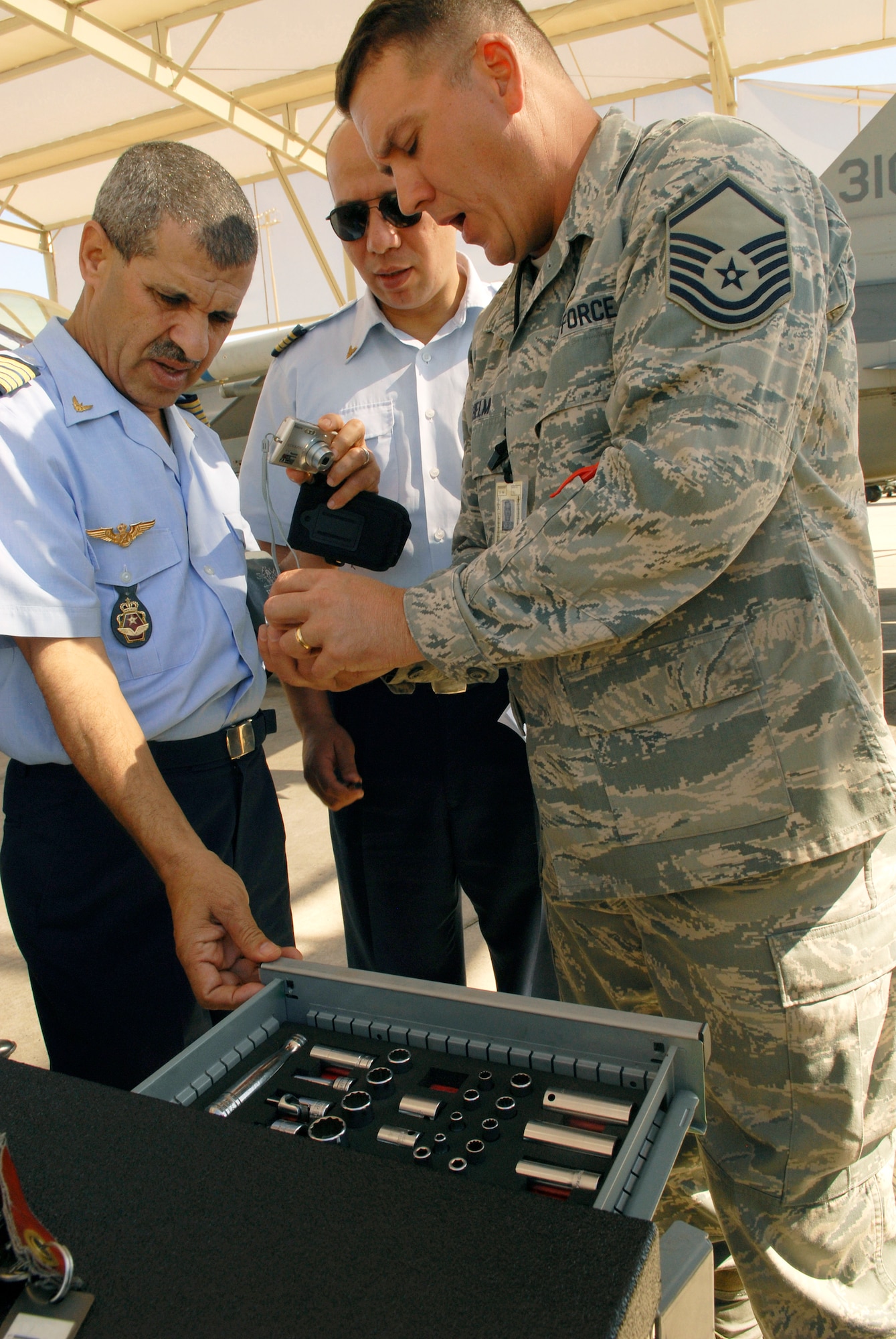 Master Sgt. Michael Helm describes features of a composite tool kit to members of the Royal Moroccan air force March 12 at Luke Air Force Base, Ariz. Members of the RMAF visited Luke AFB to learn about Air Force maintenance procedures. Sergeant Helm is assigned to the 310th Aircraft Maintenance Unit. (U.S. Air Force photo/Staff Sgt. Ian Dean) 
