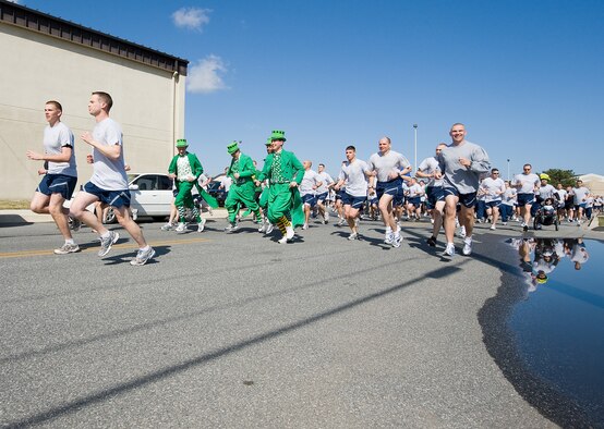 Team Dover members run on base in the five kilometer Warrior Run March 17.  Warrior Runs are held monthly to build morale and emphasize fitness.  (U.S. Air Force photo/Tom Randle)