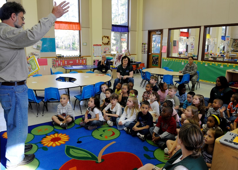 MOODY AIR FORCE BASE, Ga. -- John Crain, 23rd Civil Engineer Squadron base forester, talks to children enrolled in the pre-kindergarten class at the Child Development Center about Arbor Day here March 19. (U.S. Air Force photo by Senior Airman Brittany Barker)

