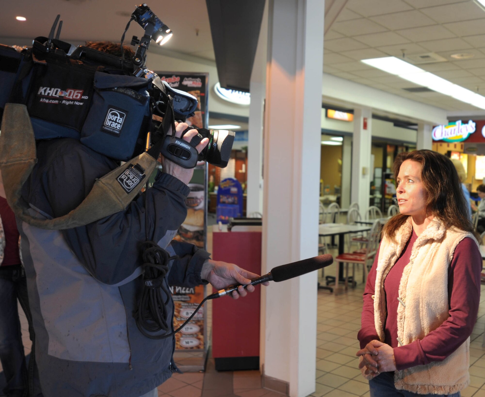 Keirsten Hess, American Red Cross Inland Northwest Chapter, gives interview with KHQ News reporter at Fairchild’s Base Exchange. The Red Cross was on base promoting their services to Armed Forces members on Mar 14.The Red Cross offers free programs such as health and safety classes and emergency communications network which operates 24 hours a day. Keirsten Hess said, “It was an outreach effort to encourage military members and their families to get to know us before they need us.” (U.S. Air Force photo/Staff Sgt. JT May III)