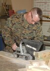 2/20/2009 - Marine Corporal Stephen Babbitt, 341st Training Squadron, cuts wood during a woodworking class at the Lackland Arts and Crafts Center. The center offers a variety of classes for do-it-yourself projects, including woodworking, automotive preventative maintenance, framing and pottery. (USAF photo by Sid Luna)        