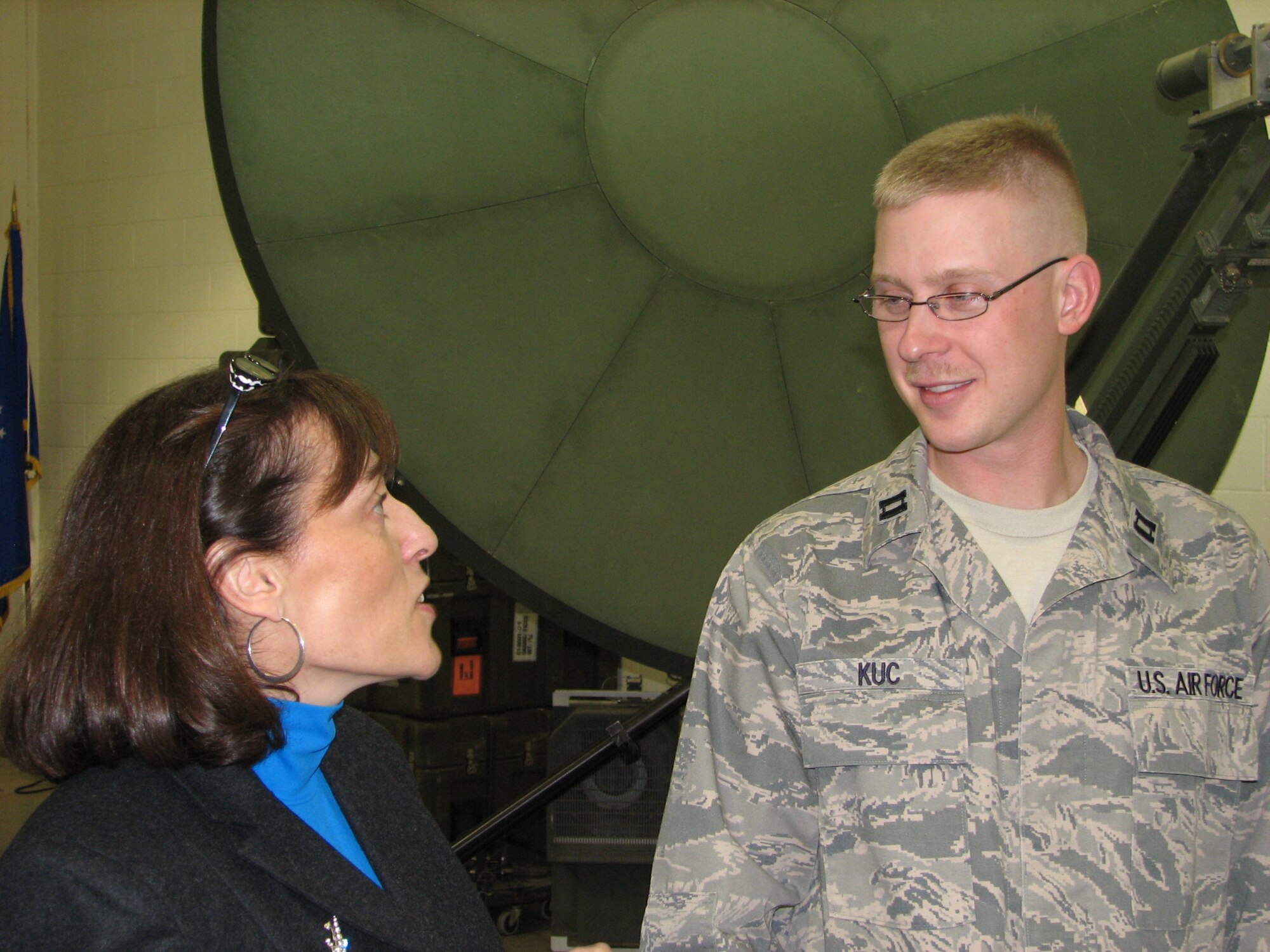 Capt. Nicholas Kuc, 31st Combat Communications Squadron, speaks with Robin Roberts Krieger, executive vice president of Economic Development for the Greater Oklahoma City Chamber of Commerce during a visit of the Tinker Leadership Council March 13. (Air Force photo/Howdy Stout)