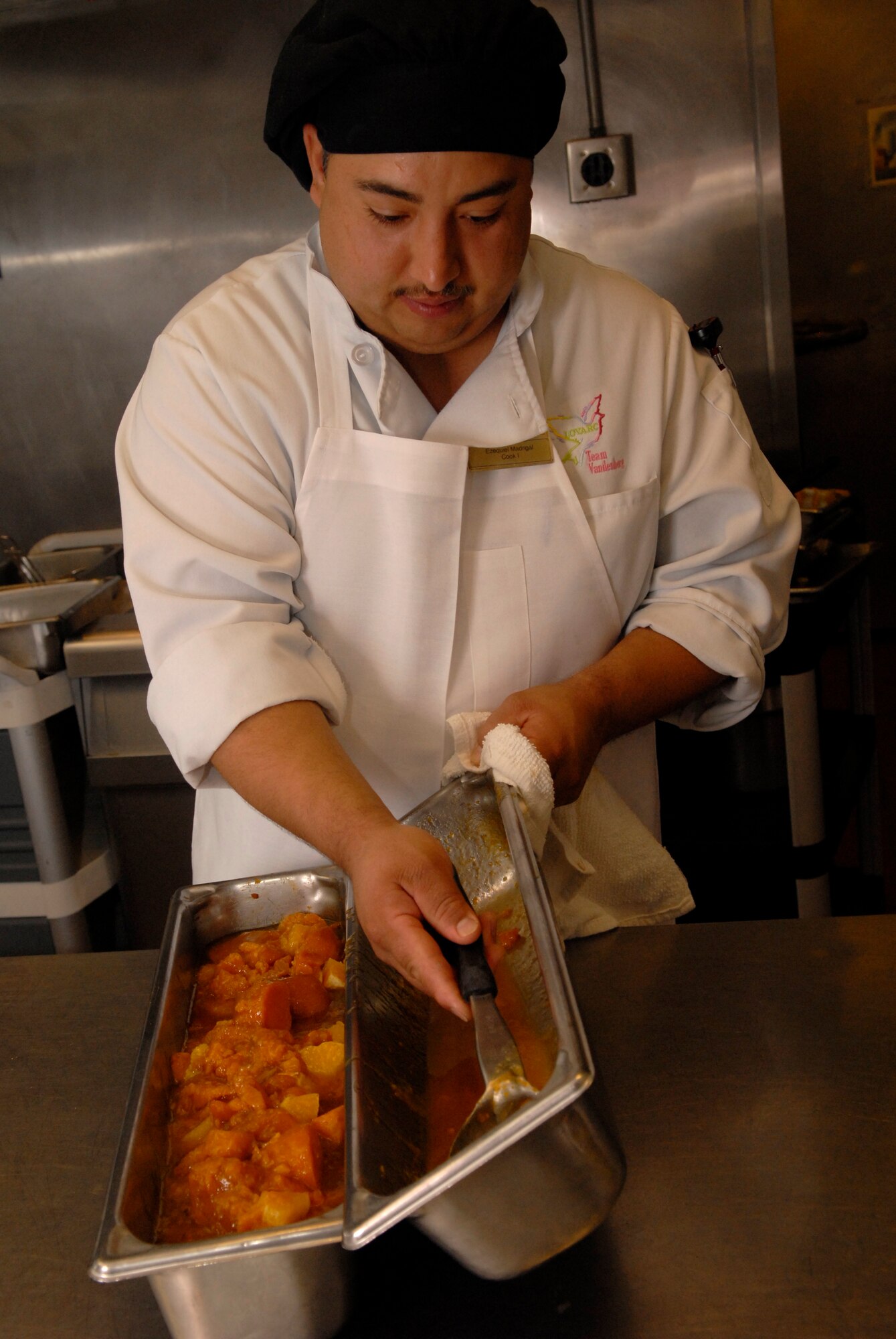 VANDENBERG AIR FORCE BASE, Calif. -- Ezequiel Madngal, a cook at Breakers Dining Facility, prepares a meal March 18. The facility is responsible for providing the nutrition Airmen need to perform their duties by being both healthy and affordable. (U.S. Air Force photo/Senior Airman Christian Thomas)
 
