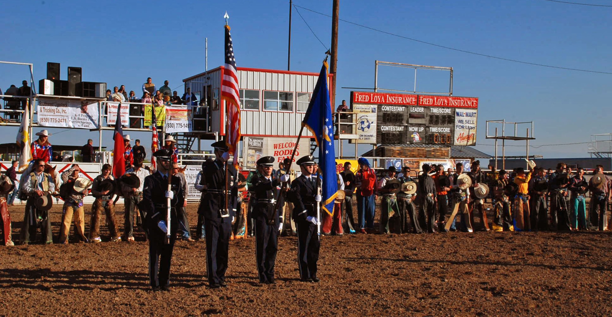 LAUGHLIN AIR FORCE BASE, Texas -- The Laughlin Air Force Base Honor Guard presents the colors before the Airman Pepe Hernandez Memorial Bull Riding Bash at the Val Verde County Fairgrounds, Del Rio, Texas, March 15. The Honor Guard and 23 other Airmen volunteered to help raise money in their off-duty time for the children of Airman Hernandez. (U.S. Air Force photo by Tech. Sgt. Charlie Miller)