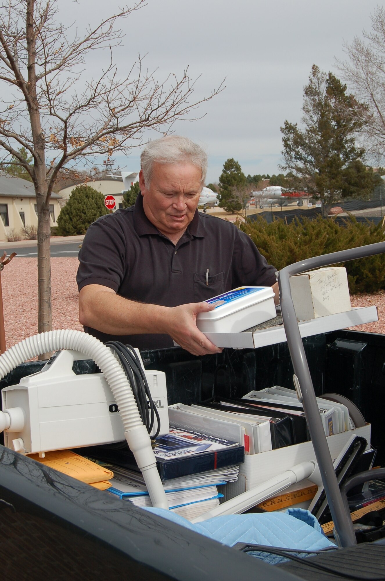 Roger Weeres, capital asset management office housing specialist, places items in a pick-up truck to move them to a new location at 300 Vincent Street, Building 1425 March 18. The CAM office, which was formerly known as the housing office, will now co-locate with agencies that offer similar services to servicemembers and their families. The new cluster of services at one location increases the visibility and interoperability of these services. The CAM office resumes normal business hours March 23. (Air Force photo by Thea Skinner)