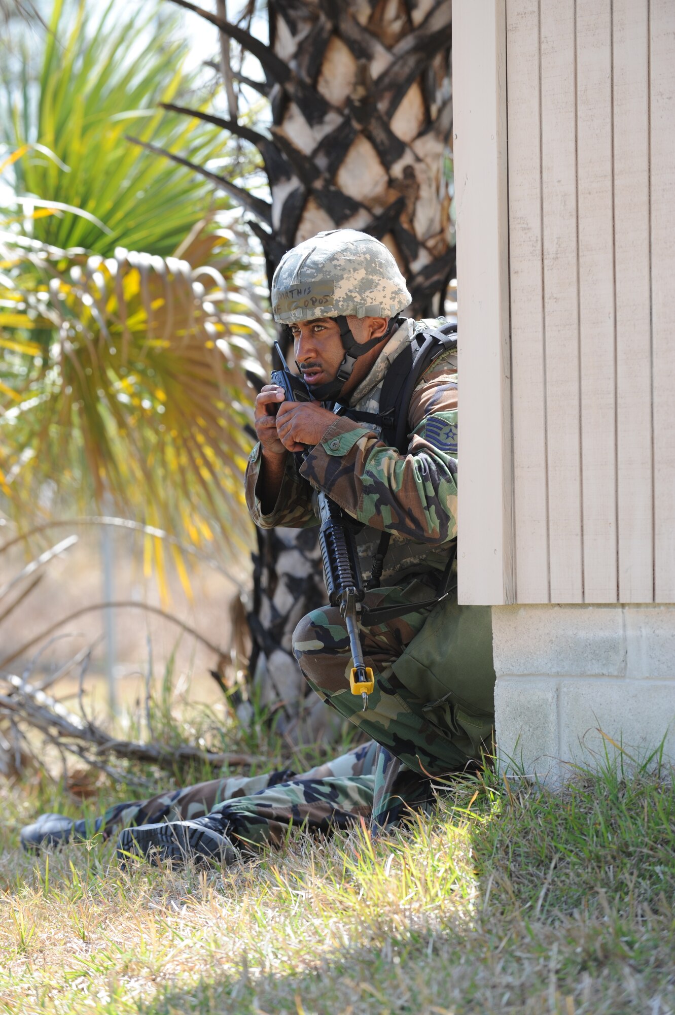 Tech. Sgt. Juan Mathis of the 45th Security Forces Squadron radios in a report of a casualty following a simulated attack at the Malabar Training Annex during the recent weeklong Operation Ocean Breeze deployment exercise. (U.S. Air Force photo/John Connell)