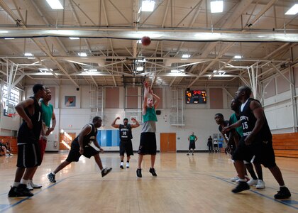 Yale Akers shoots his free throw during an intramural basketball game at the Fitness and Sports Center here Mar. 18. AMXS defeated the SFS team 50-46. Akers is with the 437th Aircraft Maintenance Squadron. (U.S. Air Force photo/Senior Airman Katie Gieratz)
