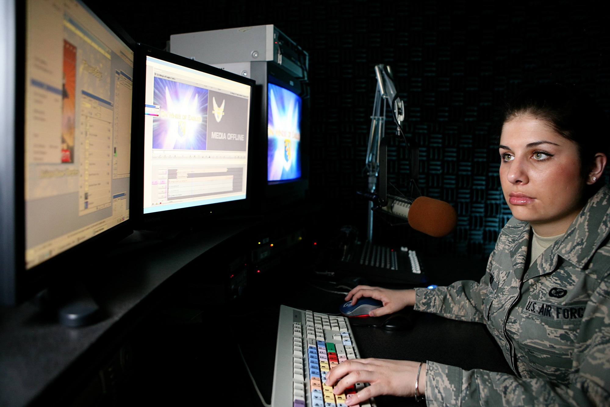 Airman Lauren Lagudi, a radio DJ on American Forces Network Aviano, Defense Media Activity, edits a project in the AFN studio March 18. Airman Lagudi is one of five members of AFN Aviano who were recently recognized as among the best in Air Force broadcasting during the 2008 Air Force Media Contest. Airman Lagudi was recognized as the Air Force's Outstanding New Broadcaster. (U.S. Air Force photo/Senior Master Sgt. Robert Valenca) 