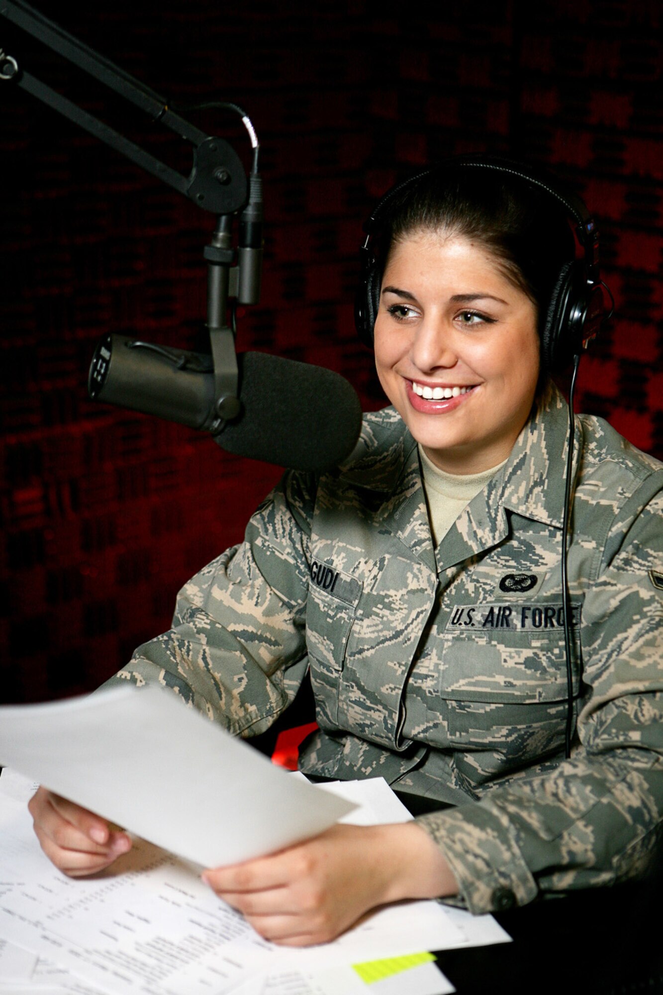 Airman Lauren Lagudi, a radio DJ on American Forces Network Aviano, Defense Media Activity, performs her morning radio show in the AFN radio booth March 17.  Airman Lagudi is one of five members of AFN Aviano who were recently recognized as among the best in Air Force broadcasting during the 2008 Air Force Media Contest. Airman Lagudi was named the 2008 Air Force Outstanding New Broadcaster. (U.S. Air Force photo/Senior Master Sgt. Robert W. Valenca)   