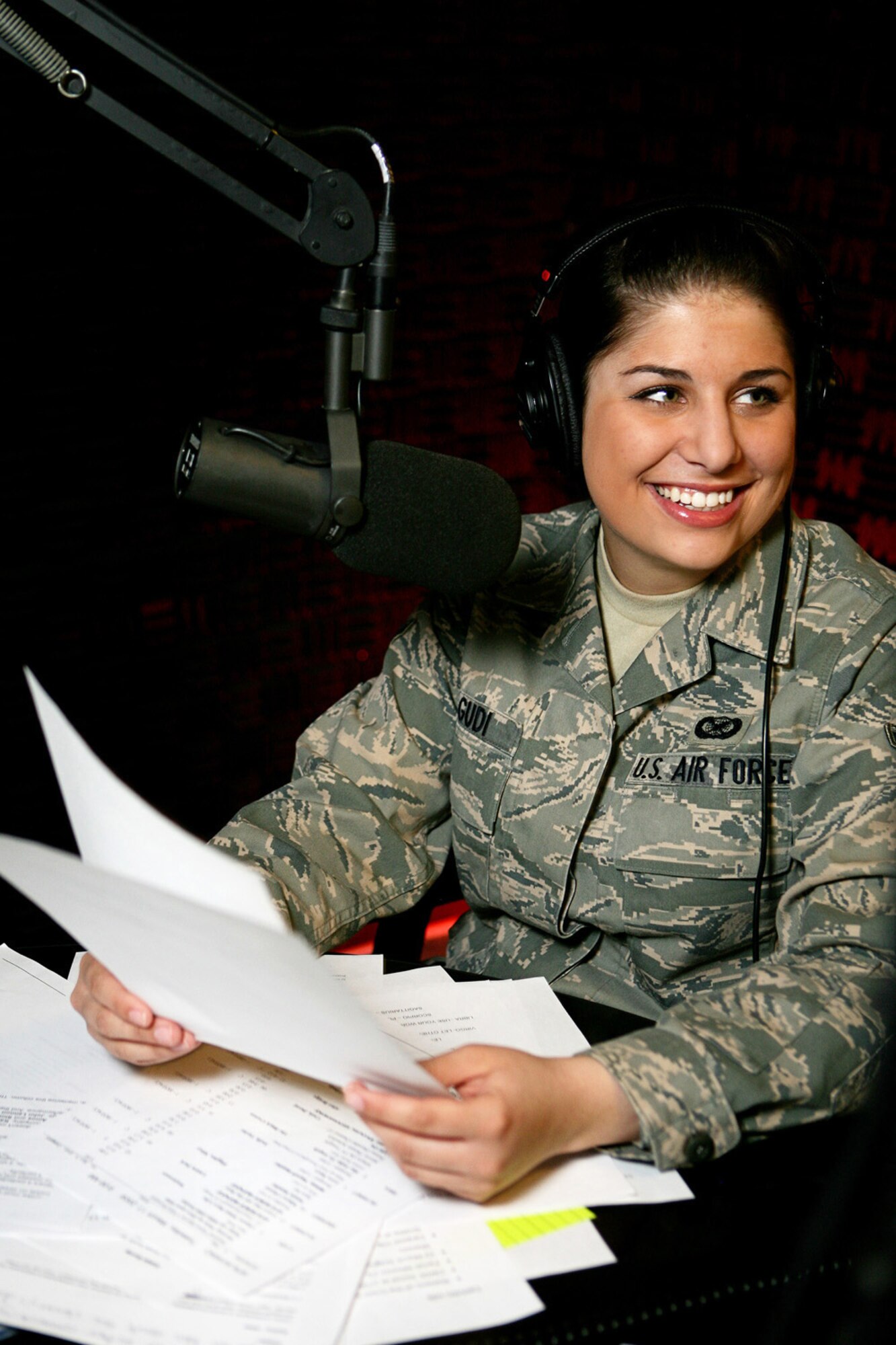 Airman Lauren Lagudi, a radio DJ on American Forces Network Aviano, Defense Media Activity, performs her morning radio show in AFN radio booth March 17. Airman Lagudi is one of five members of AFN Aviano who were recently recognized as among the best in Air Force broadcasting during the 2008 Air Force Media Contest. Airman Lagudi was recognized as the Air Force's Outstanding New Broadcaster. (U.S. Air Force photo/Senior Master Sgt. Robert Valenca) 