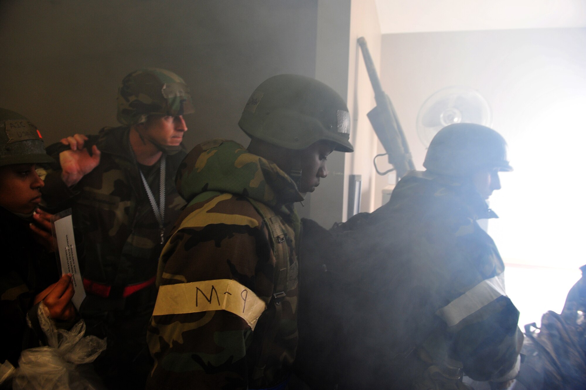 SHAW AIR FORCE BASE, S.C.- Airmen working in the Emergency Operations Center evacuate the building in response to a simulated fire during an operational readiness exercise, March 17, 2009. This ORE is crucial to Shaw's preparation for an upcoming operational readiness inspection in June. (U.S. Air Force Photo by Senior Airman William Coleman)