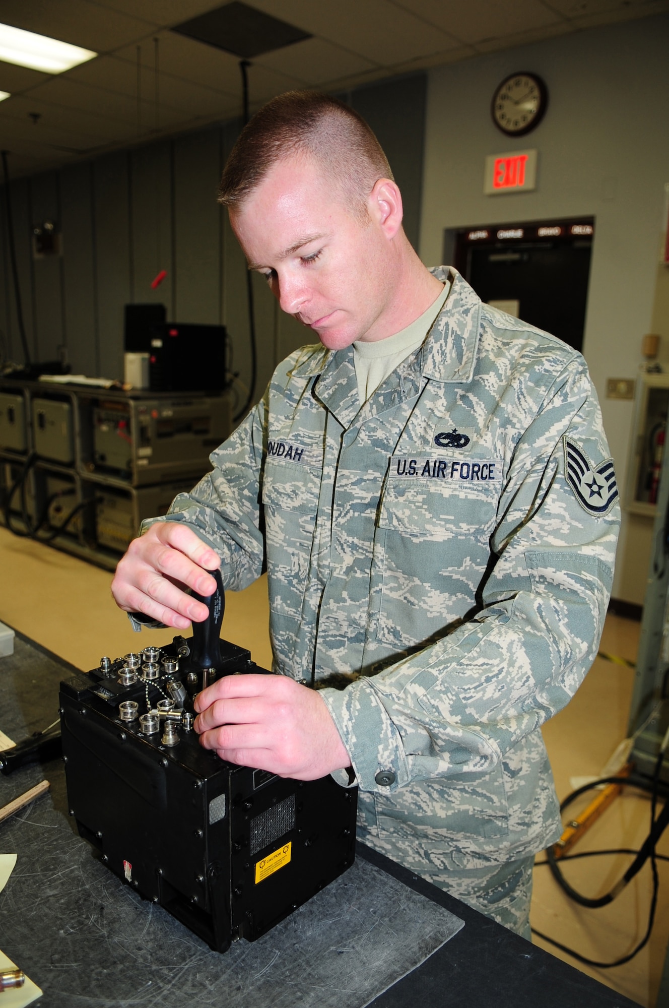 Staff Sgt. Jason Boudah, 4th Component Maintenance Squadron, tightens a screw on a wiring hub for an F-15E Strike Eagle at Seymour Johnson Air Force Base, N.C., March 10, 2009. 4th CMS is made up of different back shops that fix many of the parts for the F-15E's stationed here. (U.S. Air Force photo by Airman 1st Class Rae Perry)