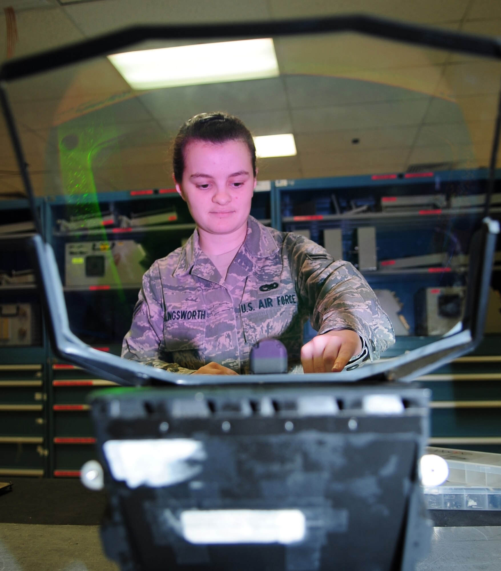 Airman 1st Class April Hollingsworth, 4th Component Maintenance Squadron, repairs the wiring in a heads-up display for an F-15E Strike Eagle at Seymour Johnson Air Force Base, N.C., March 10, 2009. The heads-up display provides a visual interface for the pilot. (U.S. Air Force photo by Airman 1st Class Rae Perry)