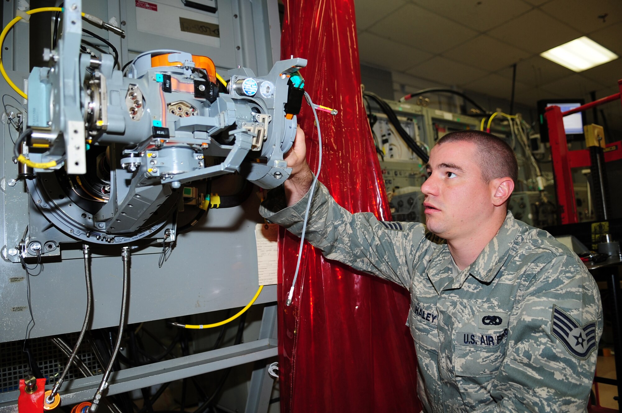 Staff Sgt. Richard Haley, 4th Component Maintenance Squadron, repairs an F-15E Strike Eagle antenna on Seymour Johnson Air Force Base, N.C., March 10, 2009. While Airmen in the 4th Aircraft Maintenance Squadron perform maintenance on the flightline, 4th CMS Airmen perform their work in back-shops, off the flightline.  (U.S. Air Force photo by Airman 1st Class Rae Perry)
