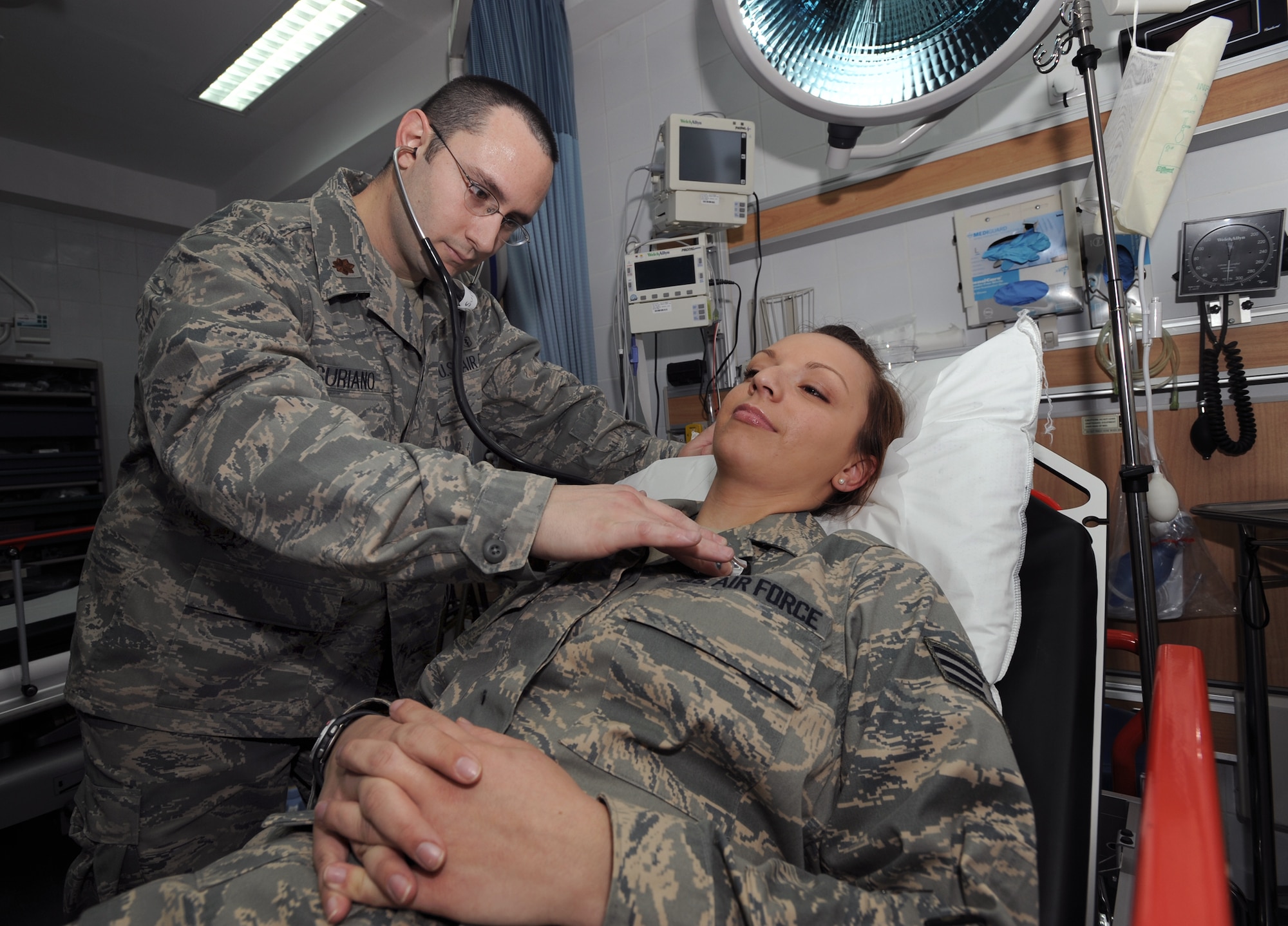 Major Jerry Suriano, a Doctor with the 379th Expeditionary Medical Group, checks a patient in the base clinic, Mar. 18, 2009, in an undisclosed location in Southwest Asia.  Major Suriano is native to Carol Stream, Ill. and is deployed from Andrews Air Force Base, M.D. in support of Operations Iraqi and Enduring Freedom and Combined Joint Task Force - Horn of Africa.  (U.S. Air Force Photo by Staff Sgt. Joshua Garcia/released) 