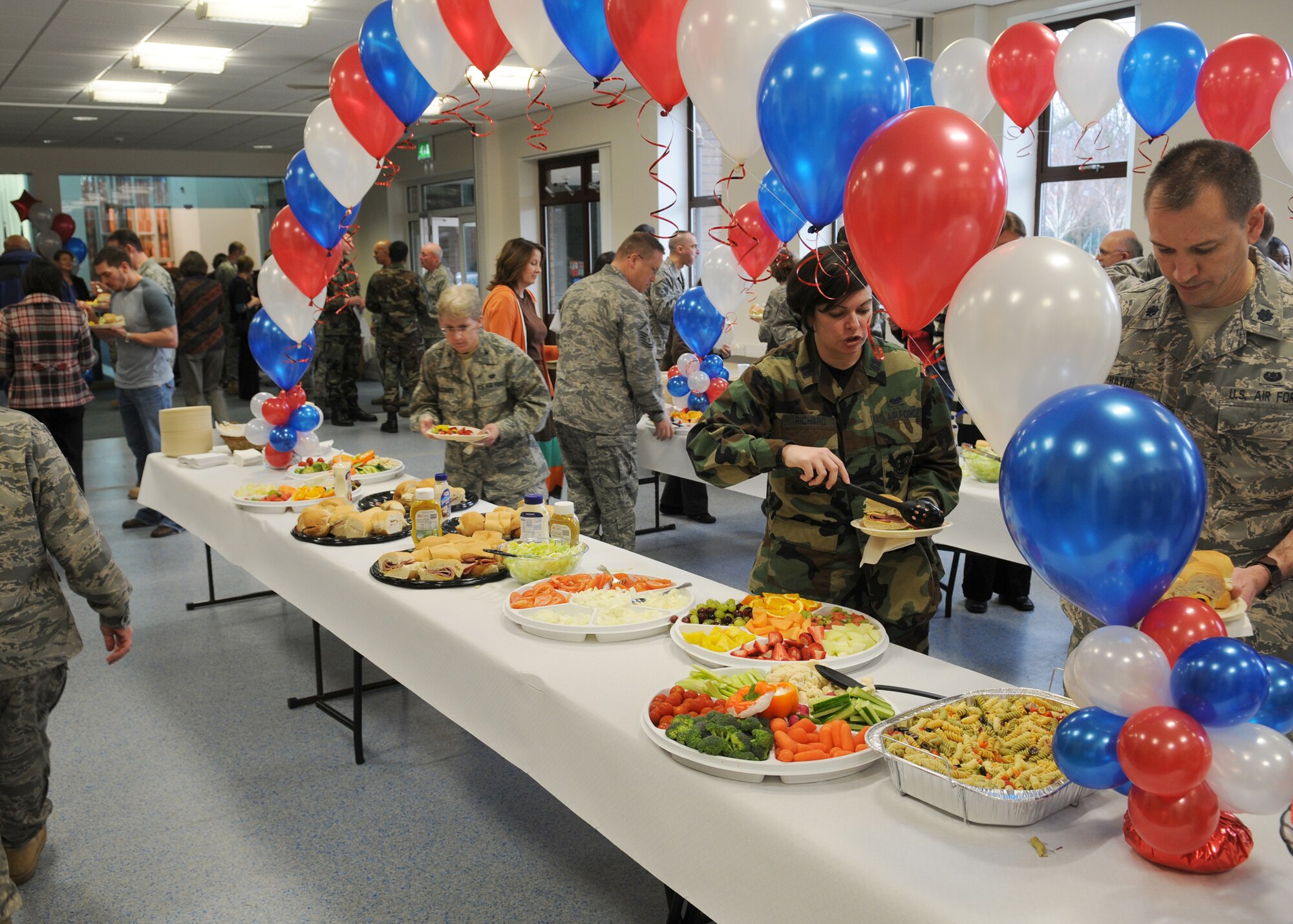 People from RAF Mildenhall enjoy a variety of sandwiches, fruits, and vegetables during the National Prayer Luncheon held at the Mildenhall Chapel March 12, 2009, at RAF Mildenhall. The chapel featured Chaplain (Maj. Gen.) Cecil R. Richardson the Air Force Chief of Chaplains, as the guest speaker to talk about “Where in the World is God?”  (U.S. Air Force photo by Staff Sgt. Jerry Fleshman)
