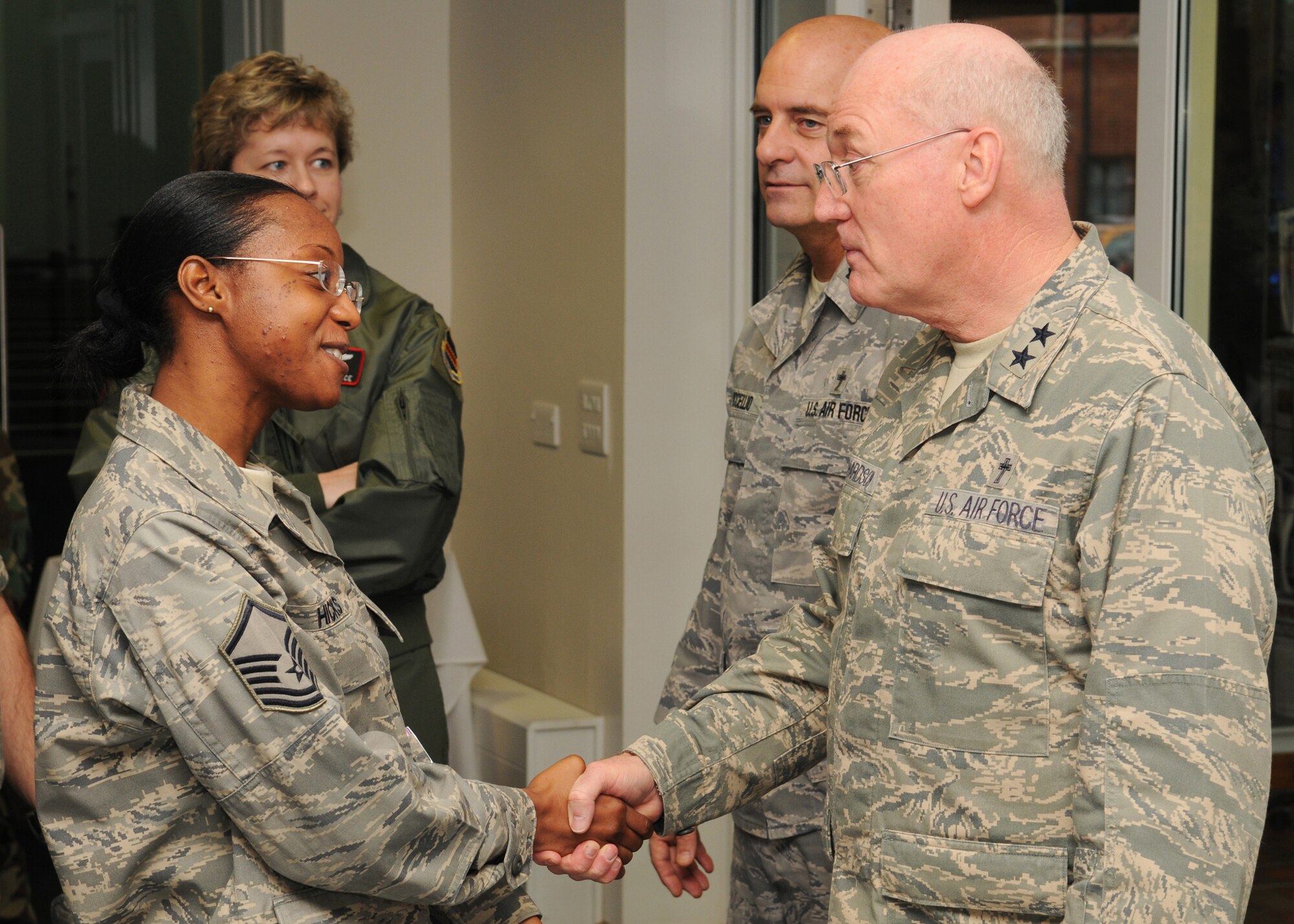 Chaplain (Maj. Gen.) Cecil R. Richardson shakes the hand of Master Sgt. Tarrah Hicks, following services at the Mildenhall Chapel during the National Prayer Luncheon March 12, 2009, at RAF Mildenhall, England. Chaplain Richardson is the Air Force Chief of Chaplains, stationed at Headquarters U.S. Air Force, Washington, D.C. He advises on matters pertaining to religious and moral welfare and establishing chaplain programs to meet religious needs to all Air Force personnel. (U.S. Air Force photo by Staff Sgt. Jerry Fleshman)