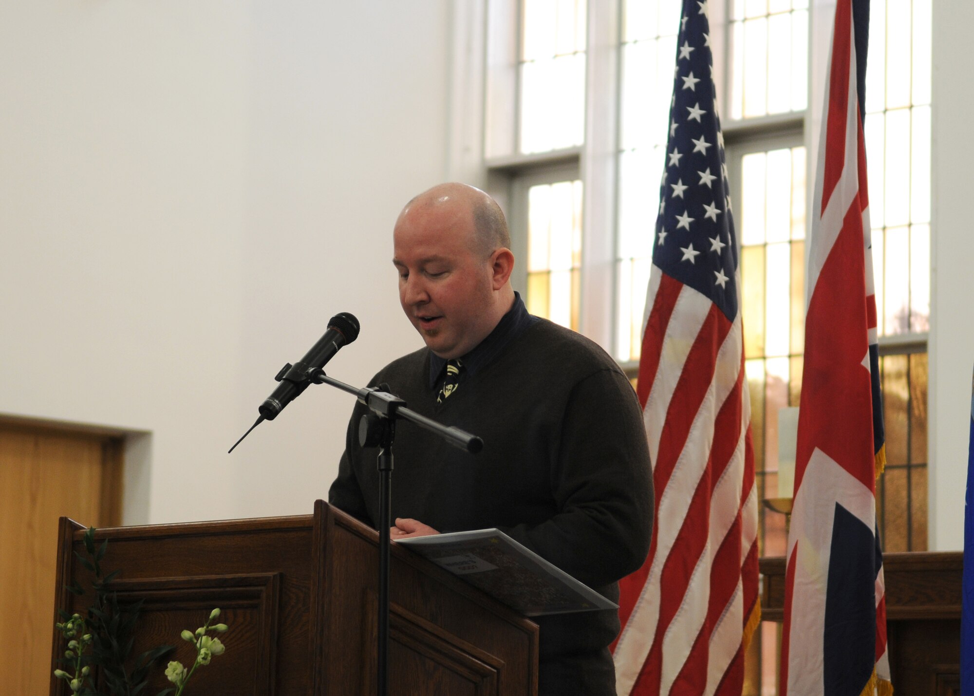 Micah Steinwandt, Single Airmen Ministry director, gives a “Prayer for the Nations” at the RAF Mildenhall Chapel during the National Prayer Luncheon March 12, 2009. The prayer luncheon featured Chaplain (Maj. Gen.) Cecil R. Richardson, the Air Force Chief of Chaplains, as the guest speaker. Following the services, the chapel provided lunch to all in attendance. (U.S. Air Force photo by Staff Sgt. Jerry Fleshman)