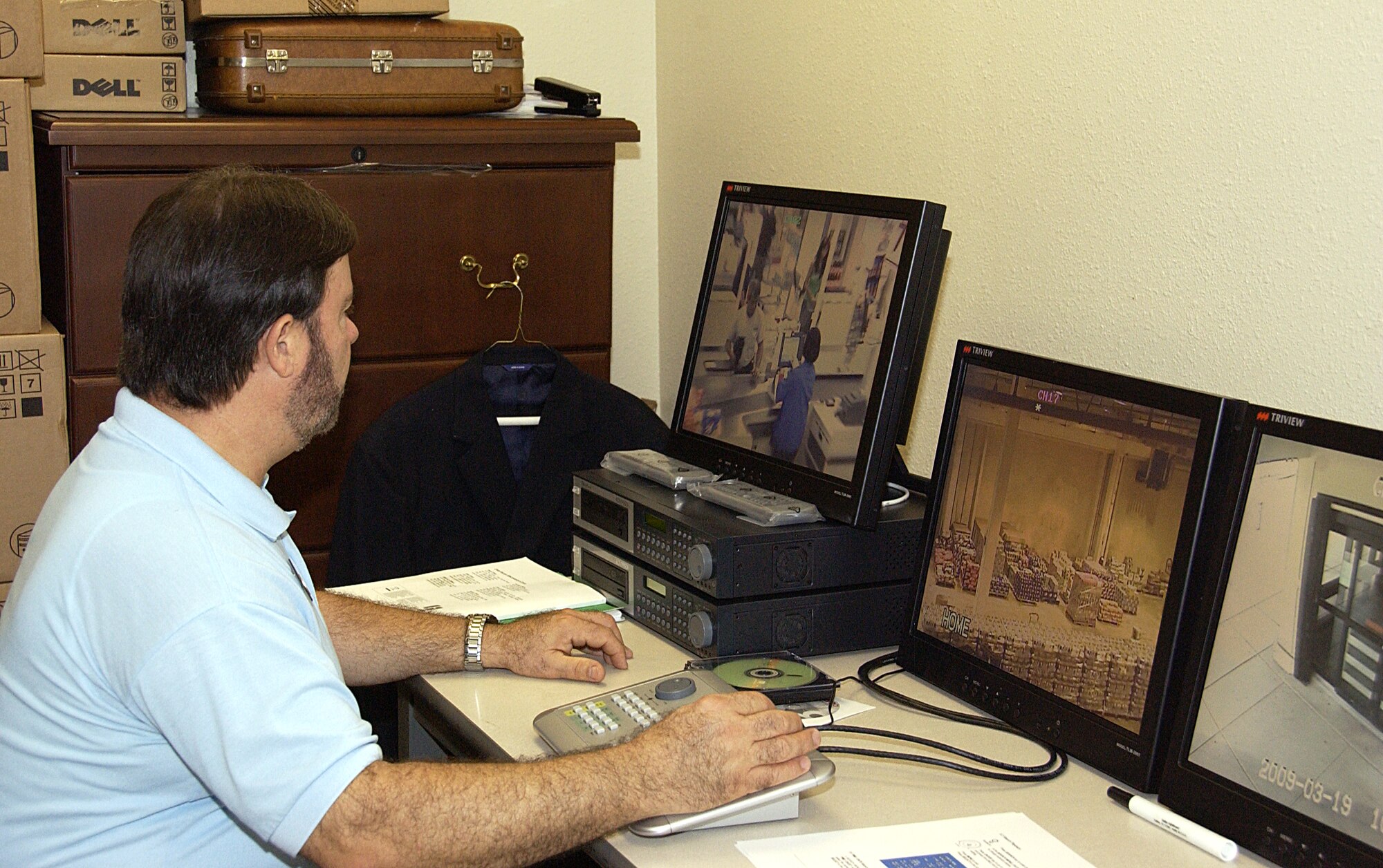 ANDERSEN AIR FORCE BASE, Guam -- James Dellinger, Defense Commissary Agency Andersen deputy commissary director, reviews data recorded from previous days on the commissary's new security system March 19. The commissary recently installed the new system in efforts to upgrade, improve loss prevention and deter potential shoplifters. (U.S. Air Force photo by Airman Carissa Wolff)                               