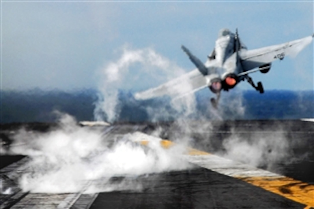 An F/A-18C Hornet launches from a waist catapult aboard the aircraft carrier USS Ronald Reagan in the Pacific Ocean, March 16, 2009. Ronald Reagan performed about 65 launches and recoveries during the day's flight operations.