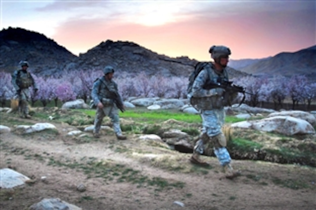 U.S. Army Sgt. Robert Newman, right,  leads his fire team on an early-morning patrol mission near Forward Operating Base Baylough in Zabul province, Afghanistan, March 19, 2009. Newman is assigned to Company B, 1st Battalion, 4th Infantry Regiment, U.S. Army Europe.

