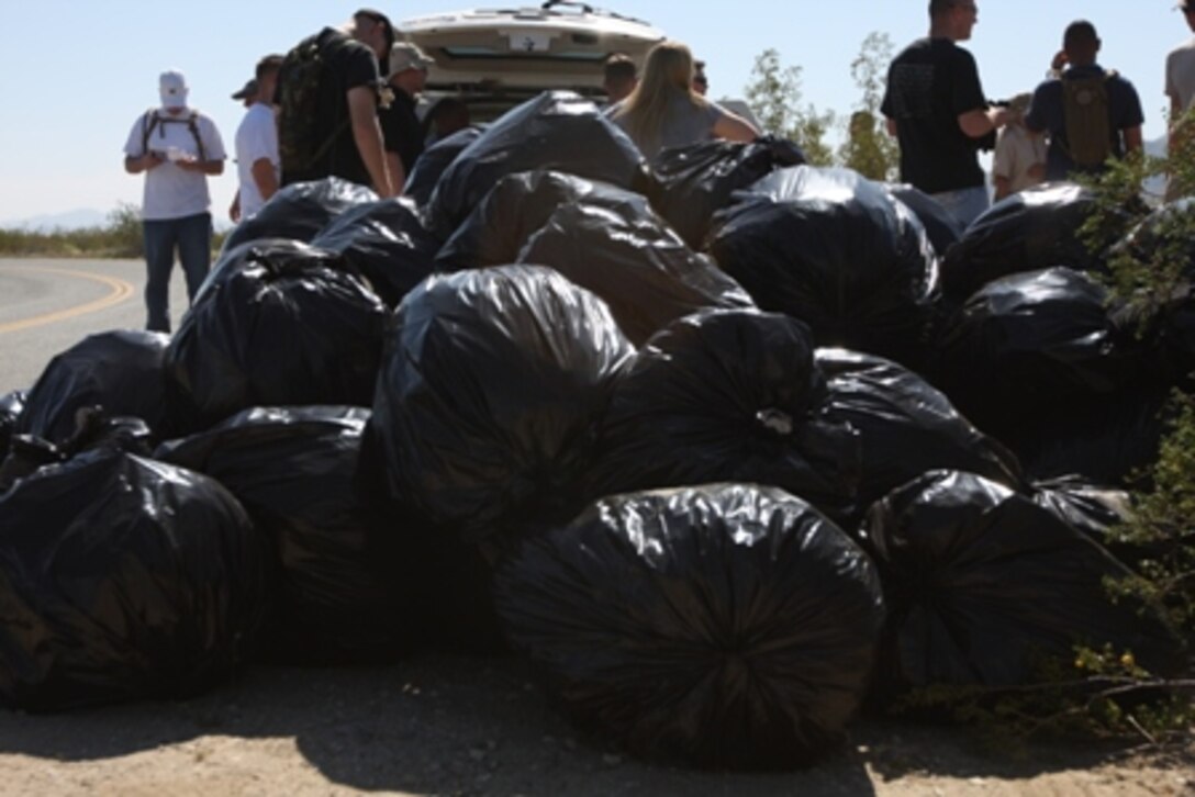 The trash bags piled up March 20 as Marines from VMU-1 filled them with Sahar mustard, a plant that is choking out the natural wildlife in Joshua Tree National Park, Calif.