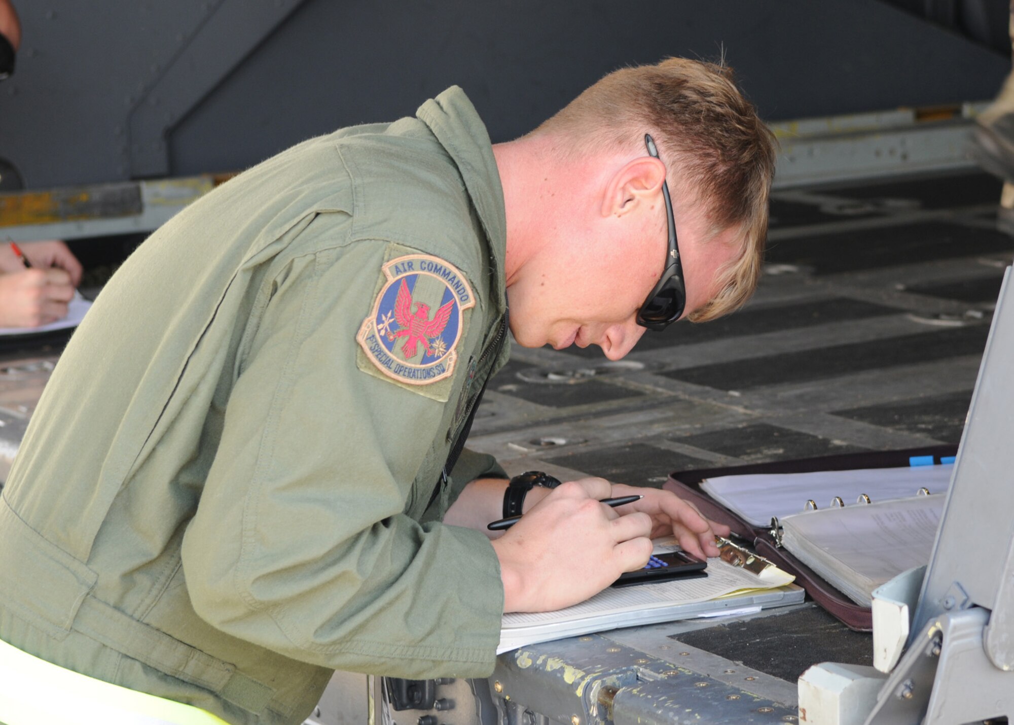 DAEGU AIR BASE, Republic of Korea -- Staff Sgt. James Kosnosky, a 1st Special Operations Squadron loadmaster, completes load plan paperwork before a high altitude, low opening jump here March 19. The training is in preparation for the group's annual operational readiness exercise which affords unit members an opportunity to practice wartime skills necessary for their ability to survive and operate. The 353rd Special Operations Group is the focal point for all U.S. Air Force special operations activities throughout the U.S. Pacific Command theater. (U.S. Air Force photo by Tech. Sgt. Aaron Cram)

