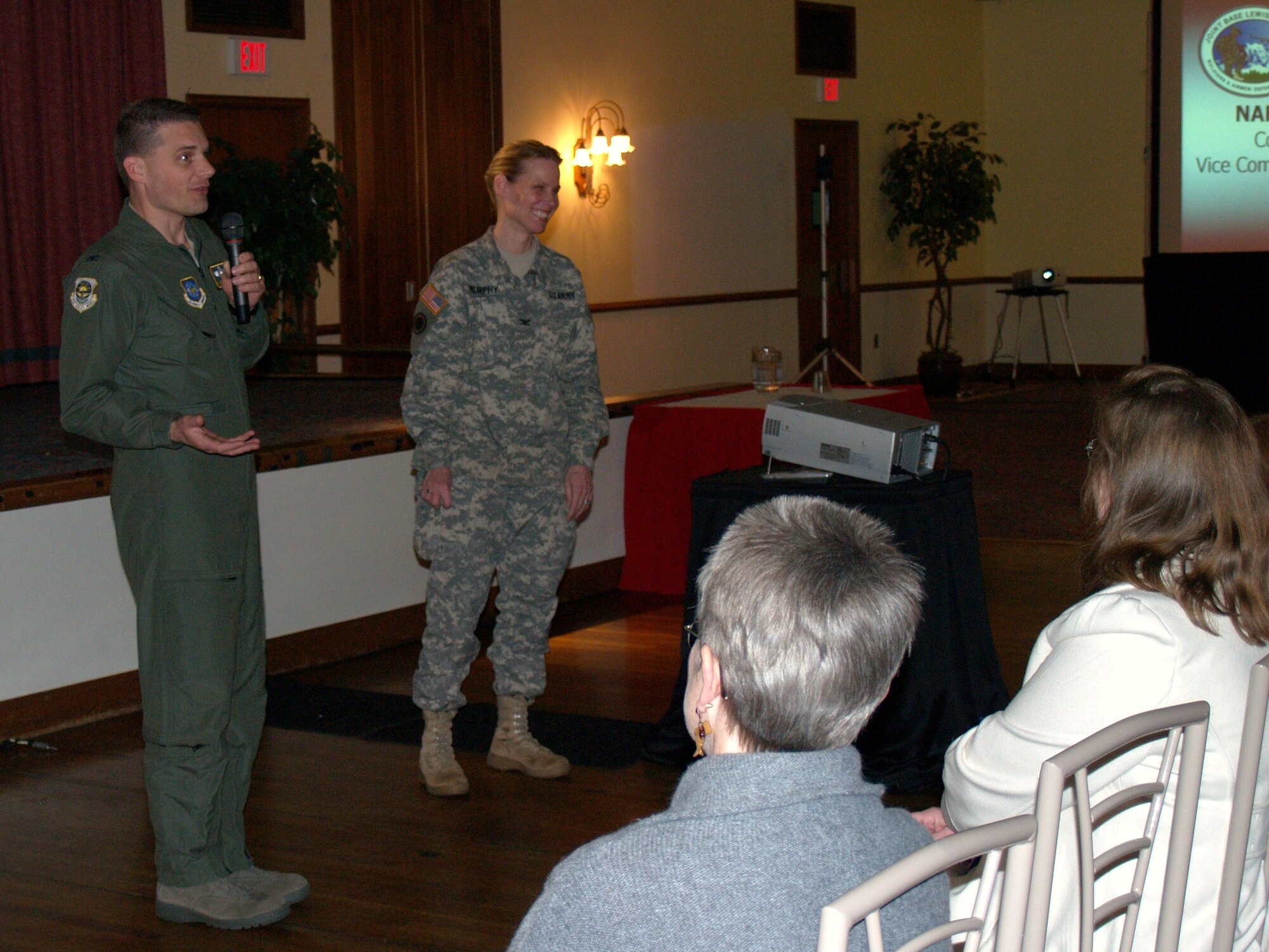 Col. Michael Hornitschek, 62nd Airlift Wing vice commander, left, and Col. Cynthia Murphy, Fort Lewis Garrison commander, field questions during the March 12 non-appropriated fund town hall forum. (U.S. Army photo/Rich Bartell)