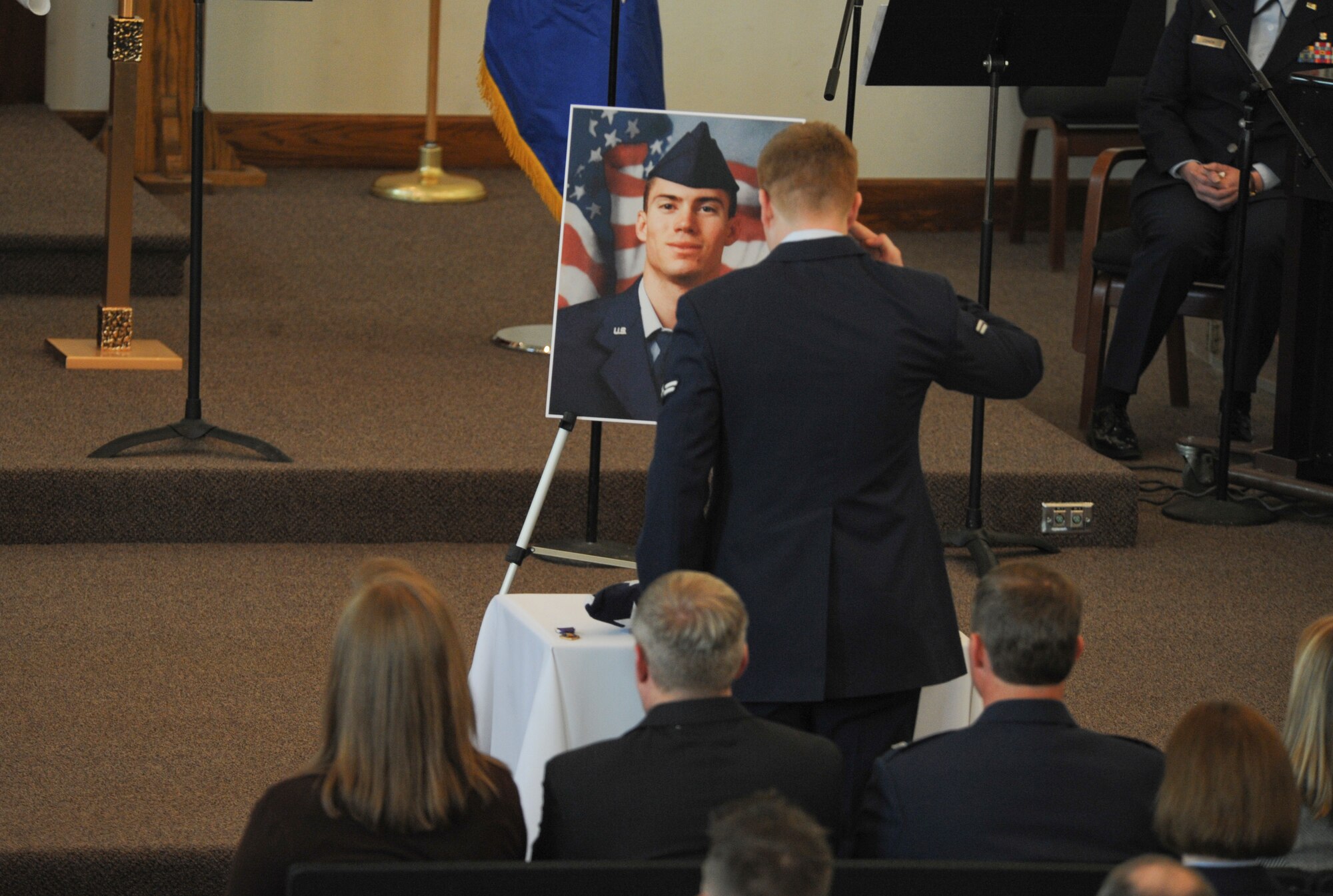 ELMENDORF AIR FORCE BASE, Alaska -- An Airman from the 3rd Logistics Readiness Squadron, renders a final salute to Staff Sgt. Timothy Bowles, 3rd LRS, at a memorial service here March 19. Bowles was killed in action in Afghanistan March 15, 2009. (U.S. Air Force photo/Senior Airman Matthew Owens)