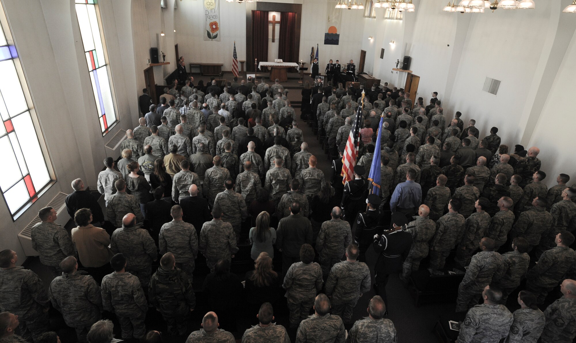 ELMENDORF AIR FORCE BASE, Alaska --  Members of the Elmendorf Honor Guard carry the colors to honor Staff Sgt. Timothy Bowles, 3rd Logistics Readiness Squadron, at a memorial service here March 19. Bowles was killed in action in Afghanistan March 15, 2009. (U.S. Air Force photo/Senior Airman Matthew Owens)
