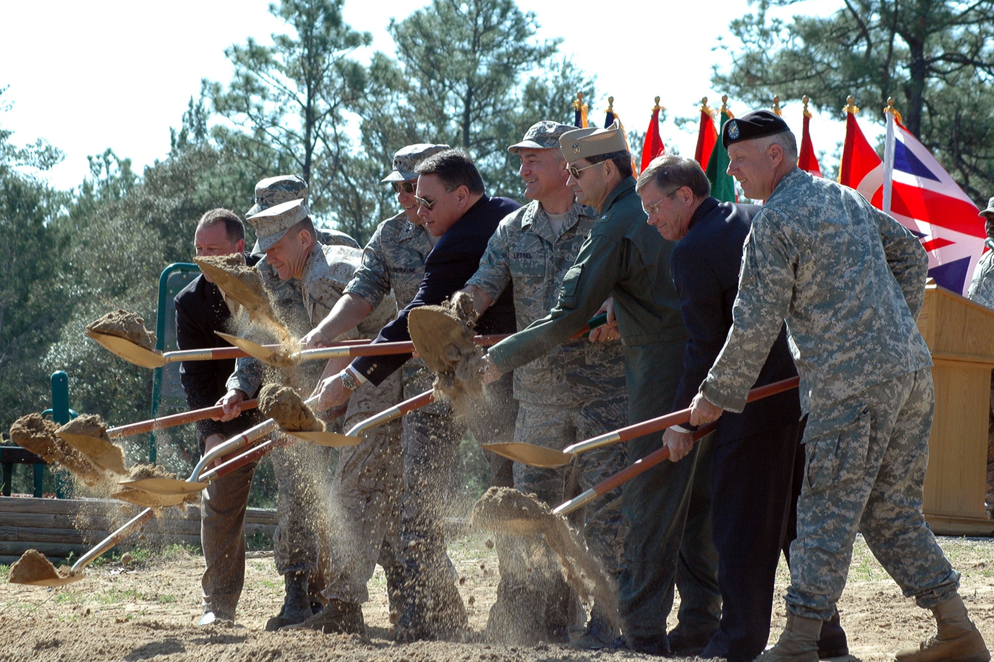 EGLIN AIR FORCE BASE, Fla. -- Kevin Billings, Maj. Gen. David Eidsaune, Maj. Gen Erwin Lessel, Maj Ge. Charles Davis, Brig. Gen Jon Davis, Rear Adrmiral David Philman, Don Searles, State Senator Don Gaetz and State Representative Ray Sansom break ground marking the beginning of construction of the F-35 Lightning II Joint Strike Fighter training facility began after a  March 20, here. (U.S. Air Force photo/ Airman Anthony Jennings)