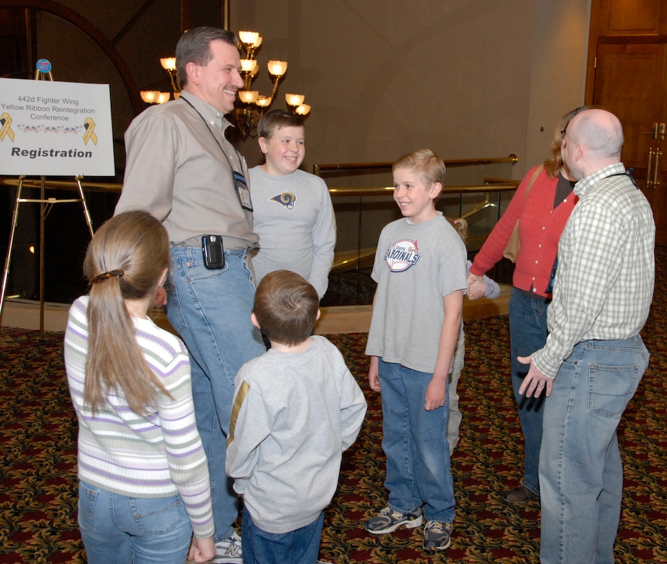 Wing Chaplain (Maj.) Jim Buckman greets 442nd Fighter Wing members and their families as they arrive at the Yellow Ribbon event sponsored by the wing in Kansas City on St. Valentine's Day. The 442nd FW is an Air Force Reserve Command A-10 Thunderbolt II unit based at Whiteman Air Force Base, Mo.