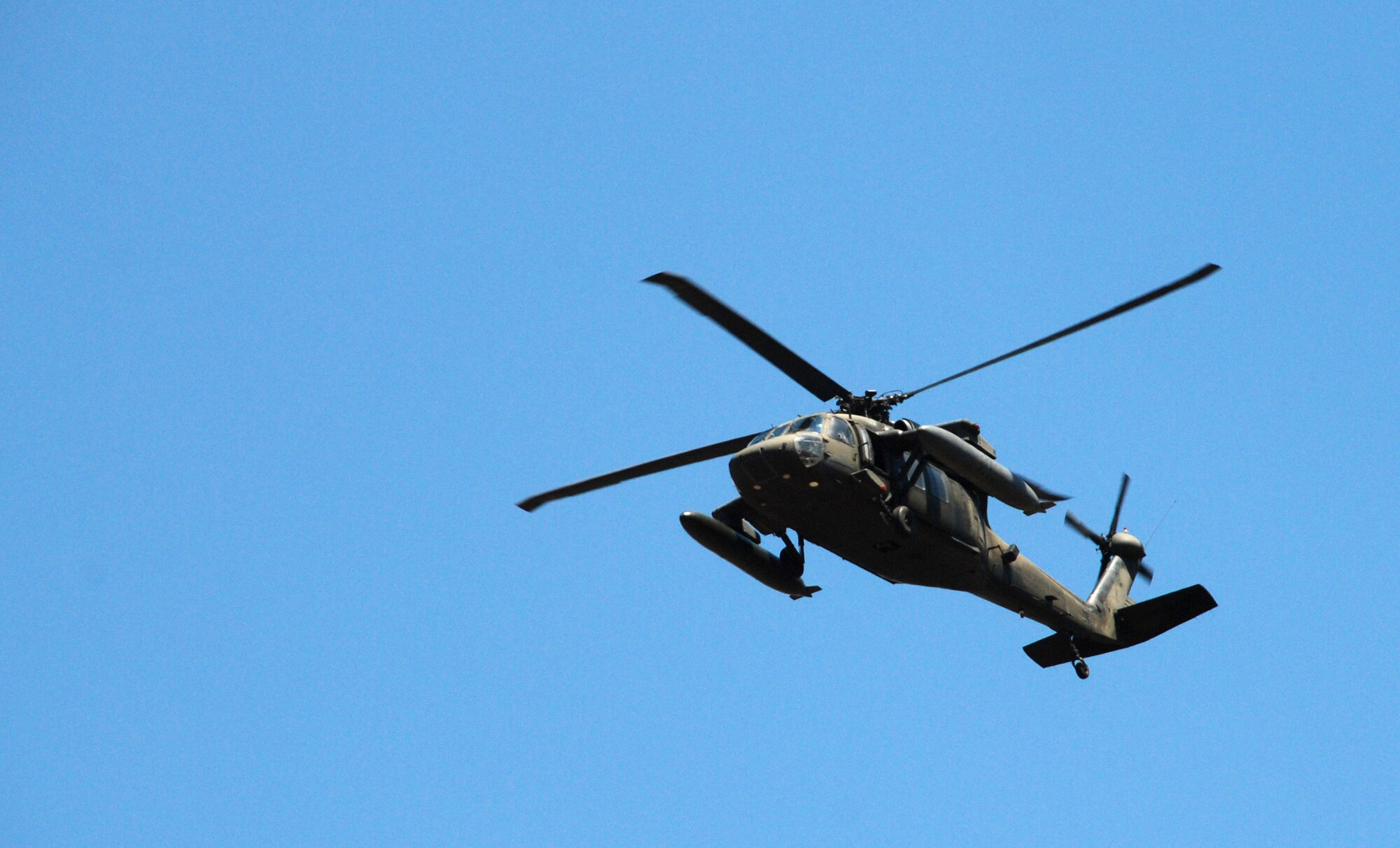 A U.S. Army HH-60 "Blackhawk" helicopter passes overhead during an exercise near La Paz, Honduras, March 20. Eighteen members of the 1st Battalion, 228th Aviation Regiment, assigned to Joint Task Force-Bravo here, took part in the day-long training exercise. The training sharpened land navigation, communication equipment, and aircraft vectoring skills. (U.S. Air Force photo/Tech. Sgt. Mike Hammond)