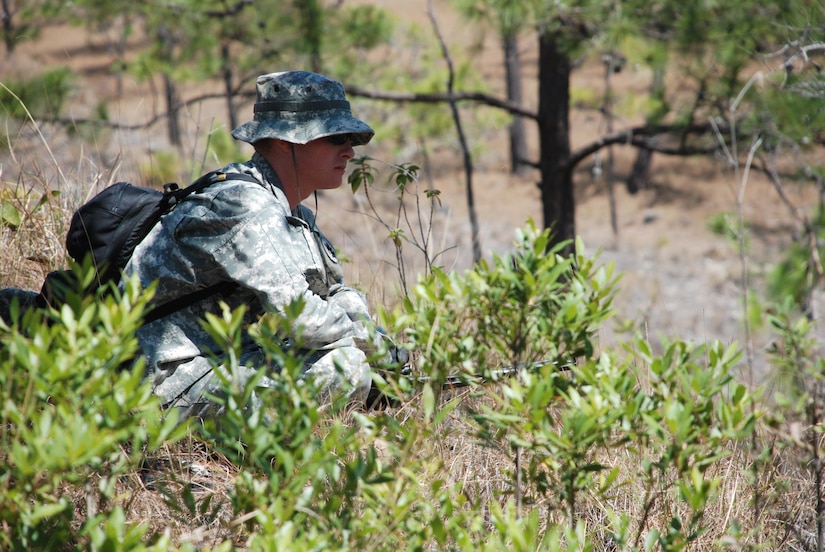 U.S. Army Capt. Lawrence Corrado scans the rocky, hilly terrain while serving as a member of the instructor cadre of an exercise near La Paz, Honduras, March 20. Eighteen members of the 1st Battalion, 228th Aviation Regiment, assigned to Joint Task Force-Bravo here, took part in the day-long training exercise. The training sharpened land navigation, communication equipment, and aircraft vectoring skills. (U.S. Air Force photo/Tech. Sgt. Mike Hammond)