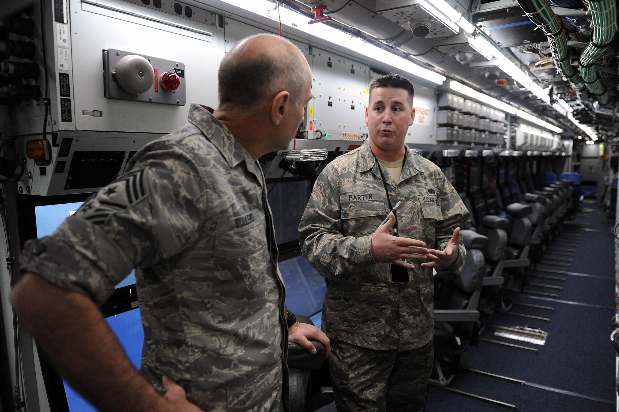 OFFUTT AIR FORCE BASE, Neb. -- ACC Commands Chief Master Sgt. Stephen C. Sullens takes a tour of an RC-135 with Tech. Sgt. Ben Parten, 97th Intelligence Squadron, as his tour guide, inside of Dock Three of the Bennie Davis Maintenance Facility, Mar 19. As part of a two day visit to the base the chief toured various facilities to get better acquainted with both the mission and Airmen of the "Fighting Fifty-Fifth."
U.S. Air Force Photo by Josh Plueger
