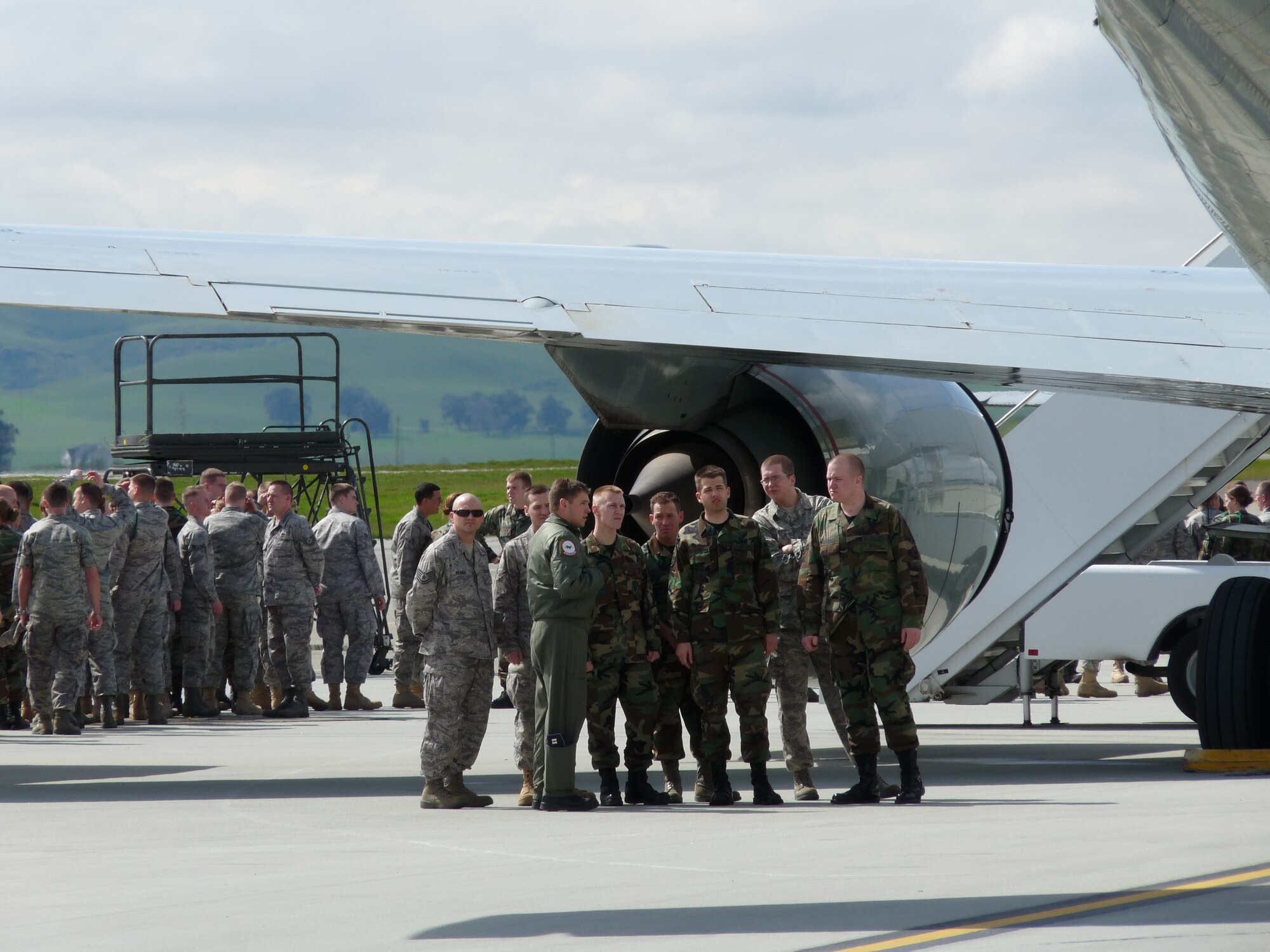 Airmen from the 311th and 314th Training Squadrons at the Presidio of Monterey, Calif., pose in front of an RC-135 V/W RIVET JOINT aircraft at Travis Air Force Base, Calif. (U.S. Air Force photo by Airman 1st Class Thomas Coyle)