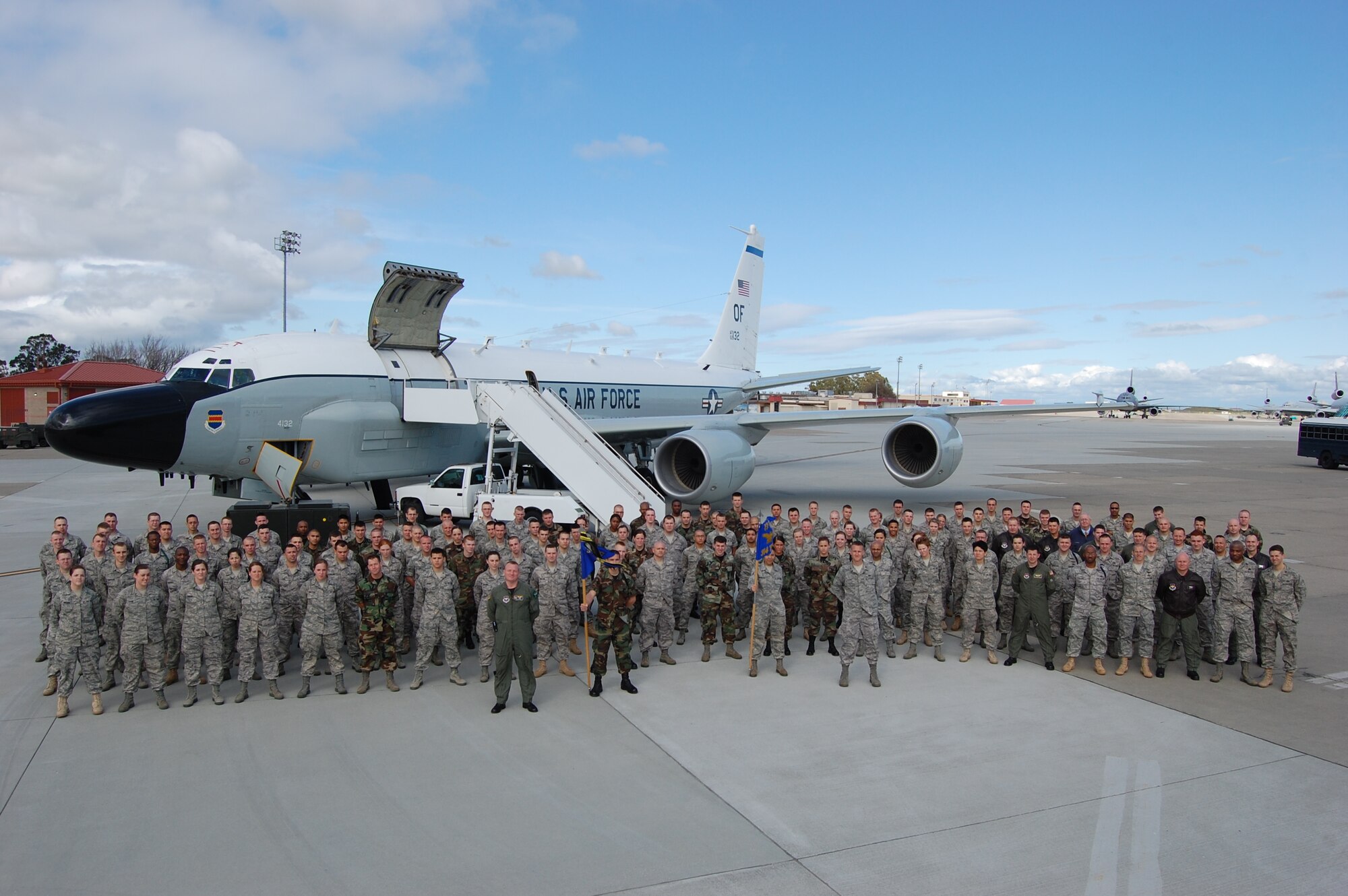Airmen from the 311th and 314th Training Squadrons at the Presidio of Monterey, Calif., pose in front of an RC-135 V/W RIVET JOINT aircraft at Travis Air Force Base, Calif. (U.S. Air Force photo by Maj. Brian Garino)