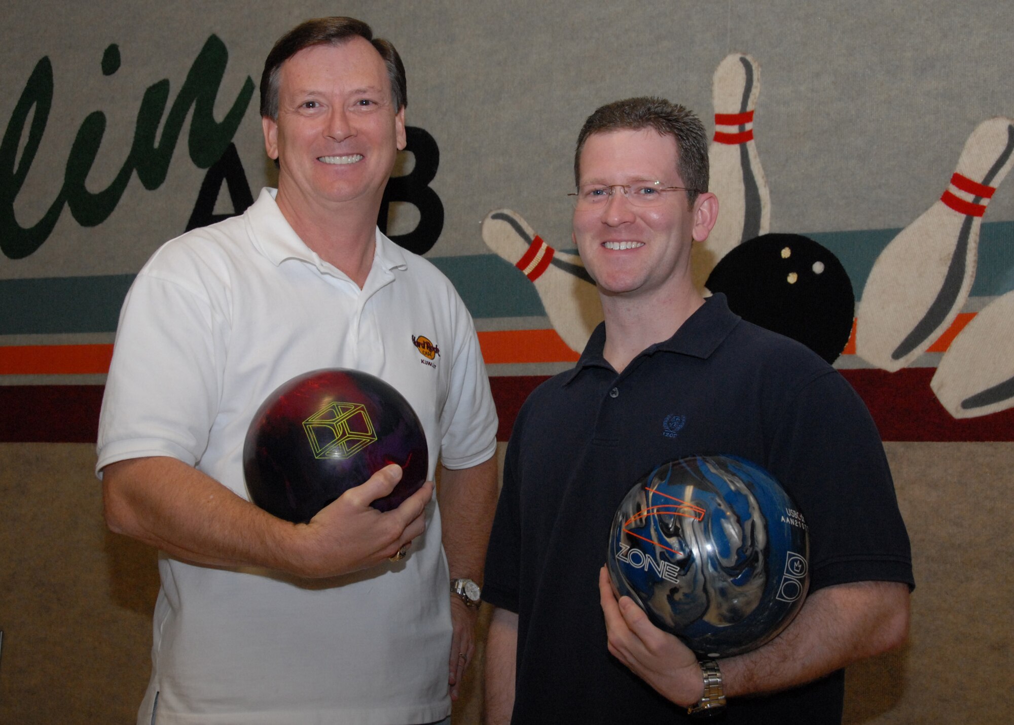 (Left to right) Dave Jefferson and Mike Ross scored a perfect 300 game during the week of March 9.  They and two other people bowled perfect games that week.  There have been only 16 perfect games since September out of more than 70,000 games bowled at Eglin Lanes.  U.S. Air Force photo/ Samuel King Jr.