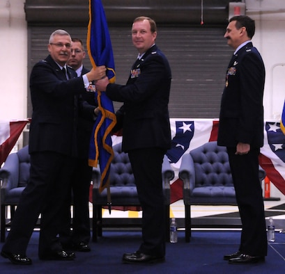 NIAGARA FALLS AIR RESERVE STATION, N.Y. - Col. Allan Swartzmiller (center) accepts the 914th Airlift Wing unit flag from Maj. Gen. Martin Mazick (left), 22nd Air Force commander.  Col Swartzmiller takes over as commander of the 914th Airlift Wing from Col. Reinhard Schmidt (right).  (U.S. Air Force photo by Senior Airman Stephanie Clark)
