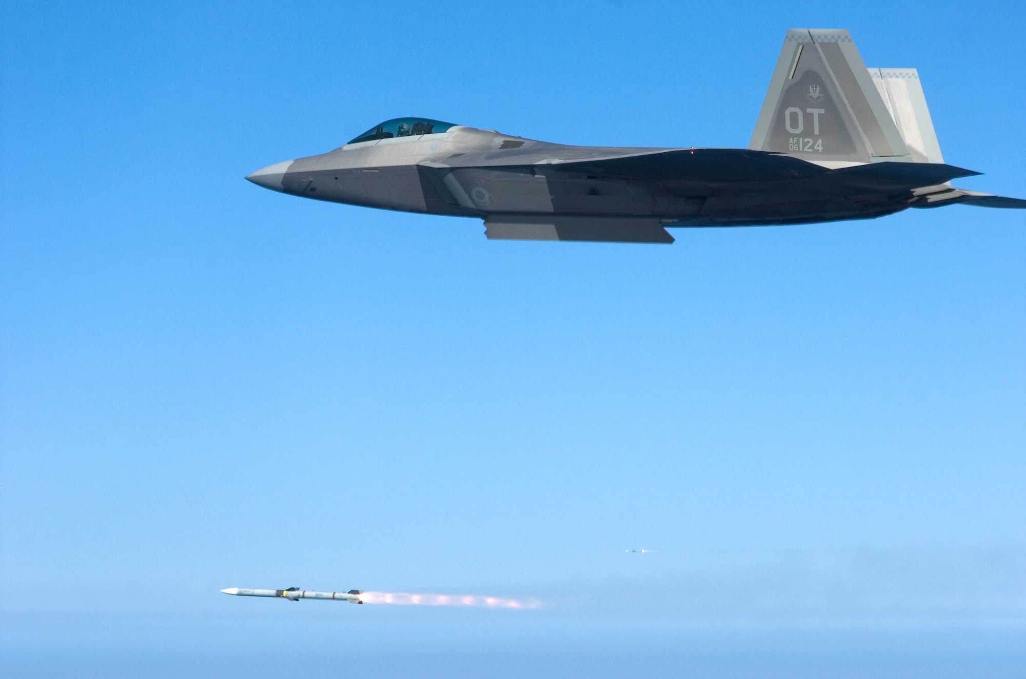 An F-22 from the 422nd Test and Evaluation Squadron, fires a missile over the Gulf of Mexico during a Combat Archer mission March 18 at Tyndall Air Force Base, Fla. The Weapons System Evaluation Program also known as Combat Archer, evaluates live air-to-air firing scenarios from beginning to end. The program covers missile movement from armory to the aircraft to all the tactics and procedures that must be used before releasing a live ordnance. This WSEP was a unique opportunity for the 83rd Fighter Weapons Squadron to evaluate a unit within its own wing. All aircraft and personnel involved belong to the 53d Wing. U.S. Air Force Photo/ Tech Sgt. Jason Wilkerson. 