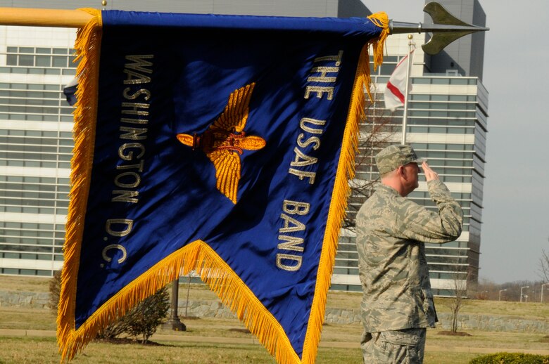 Lt. Col. Alan Sierichs, United States Air Force Band deputy commander, salutes March 18 during a retreat ceremony at the base flag pole. Due to the day light savings time change, retreat will be sounded daily at 5 p.m. The retreat ceremony signals the end of the official duty day and also serves as a ceremony for paying respect to the flag. Upon hearing the first note of retreat, military members in uniform should face the flag if visible or face the music if the flag is not visible and assume the position of parade rest. At the start of the National Anthem, military members in uniform should come to attention and salute until the anthem has ended. (U.S. Air Force photo by Staff Sgt. Dan DeCook)