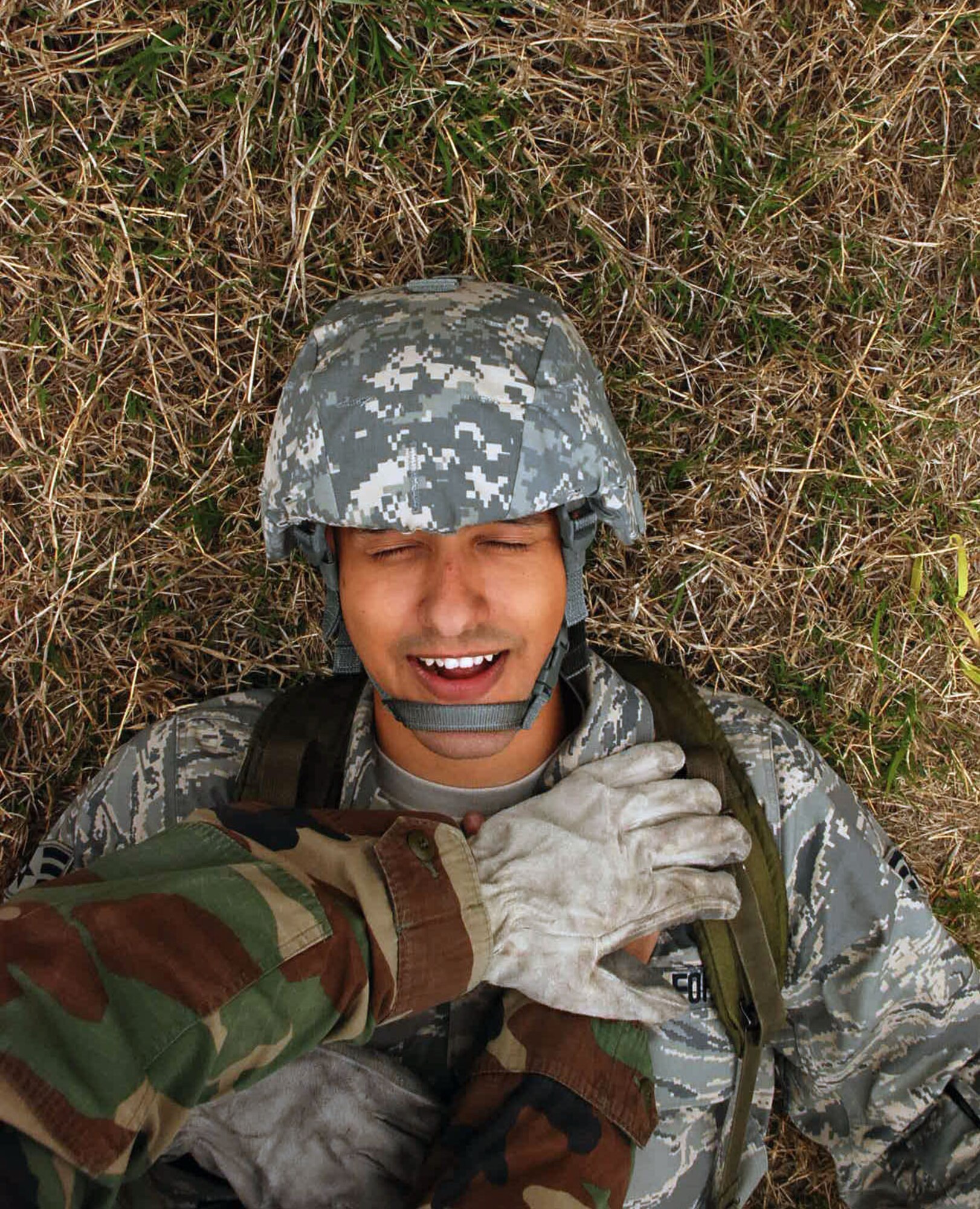 LAUGHLIN AIR FORCE BASE, Texas –Senior Airman Jesus Aldaz, 47th Medical Support Squadron, receives simulated medical attention for a sucking chest wound during the Ability to Survive and Operate exercise here March 18. The ATSO exercise consisted of more than 50 Laughlin Airmen working together to sharpen their war-fighting skills by completing different scenarios they could possibly face in a deployed location. (U.S. Air Force photo by Airman 1st Class Sara Csurilla)