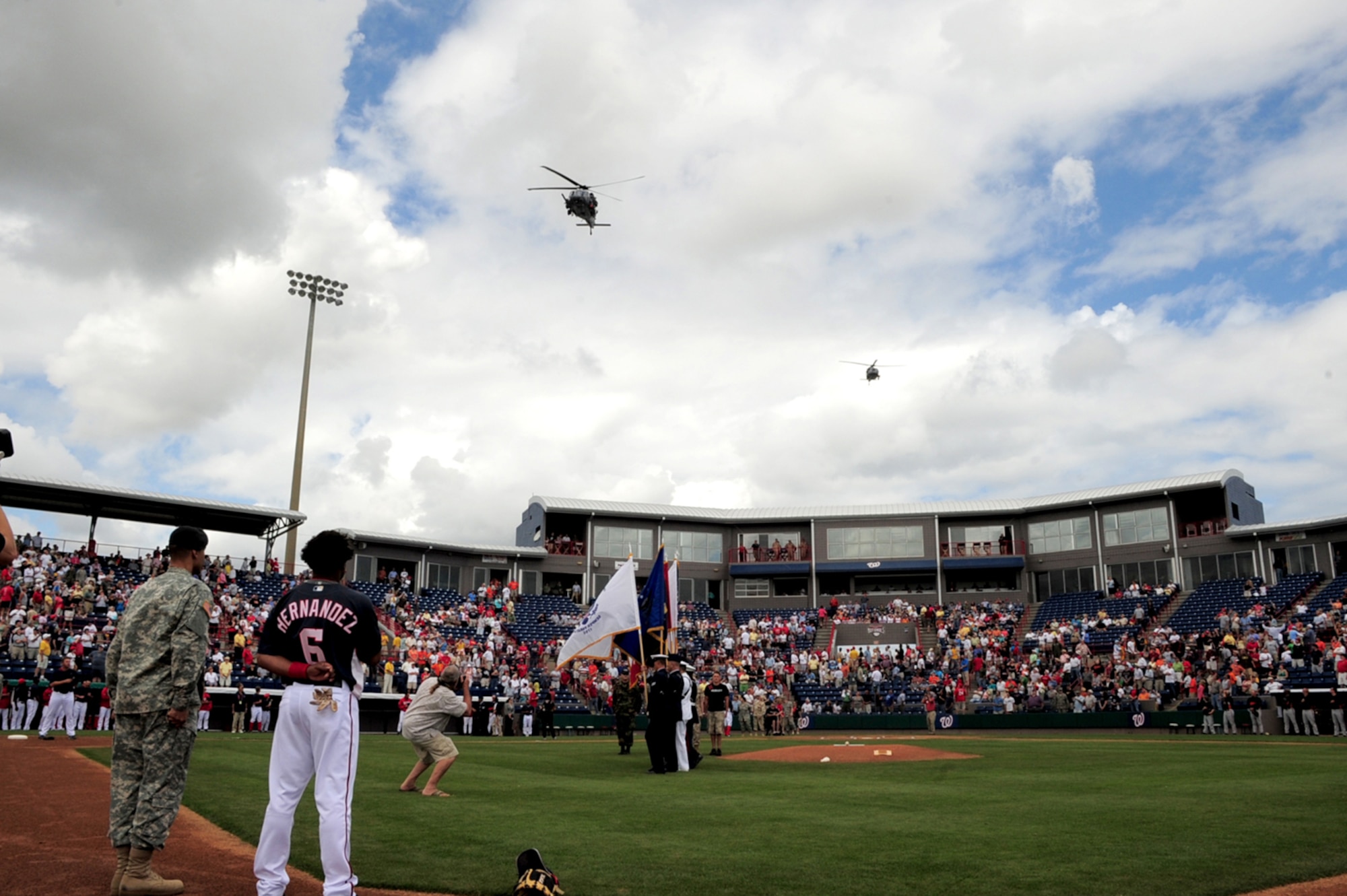 PATRICK AIR FORCE BASE, Fla. - Air Force Reserve crews piloted two HH-60G Pave Hawk helicopters from the 920th Rescue Wing here during the opening ceremonies of a Washington Nationals spring training baseball game which honored military personnel March 19.  The Nationals beat the Baltimore Orioles, 5-4. (U.S. Air Force Photo/Capt. Cathleen Snow)