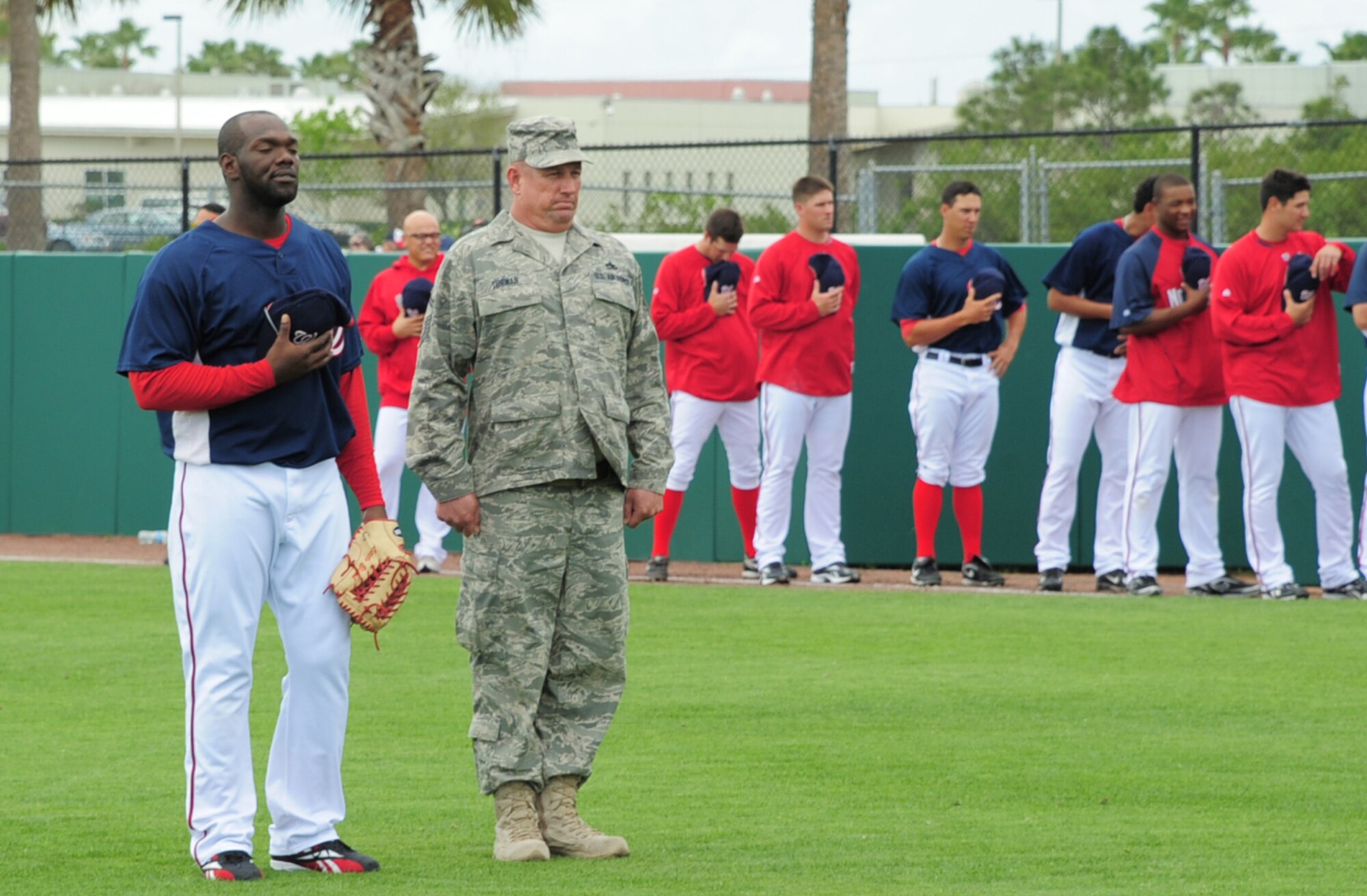 PATRICK AIR FORCE BASE, Fla. - Senior Master Sgt. James Turman, 920th Rescue Wing maintenance, stands next to Washington Nationals outfielder Elijah Dukes during the pre-game ceremonies at the Space Coast Stadium in central Florida.  The Nationals honored the local military March 19 during a spring training game against the Baltimore Orioles.  The Nationals  won 5-4. (Photo/Capt. Cathleen Snow).