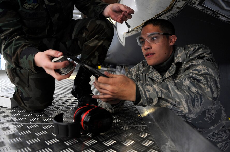 Senior Airman Alexis Soto cuts wire to safety wire a dehydrator on a B-1B Lancer at Ellsworth Air Force Base, S.D., March 19. Airman Soto is assigned to the 28th Air Maintenance Squadron at Ellsworth AFB.  (U.S. Air Force photo/Staff Sgt. Desiree N. Palacios)

