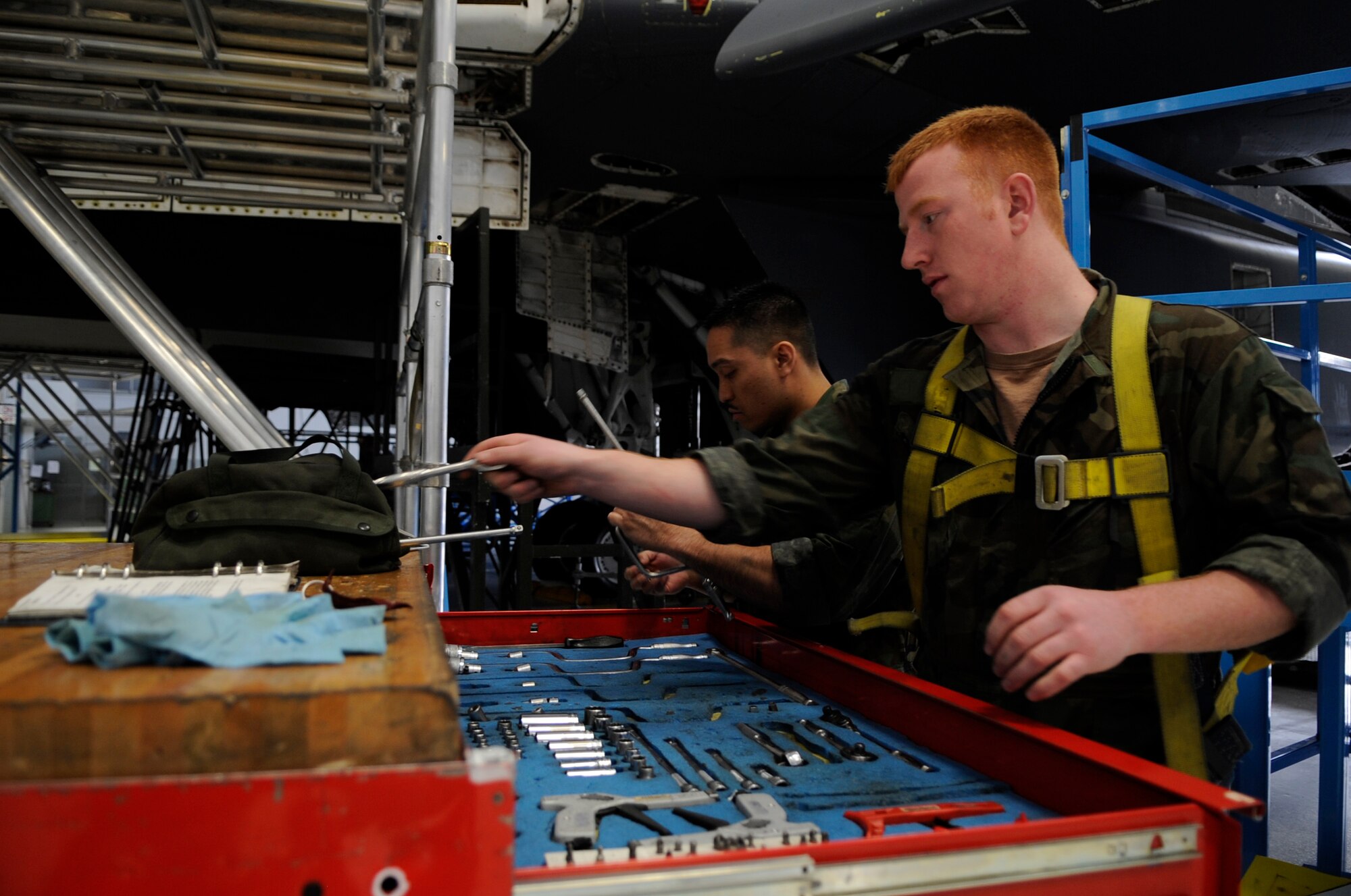 Airman 1st Class Eric Smith and Staff Sgt. Walter Nogra gather tools to perform maintenance on a B-1B Lancer at Ellsworth Air Force Base, S.D., March 19.  Airman Smith and Sergeant Nogra are assigned to 28th Maintenance Squadron at Ellsworth AFB. (U.S. Air Force photo/Staff Sgt. Desiree N. Palacios)

