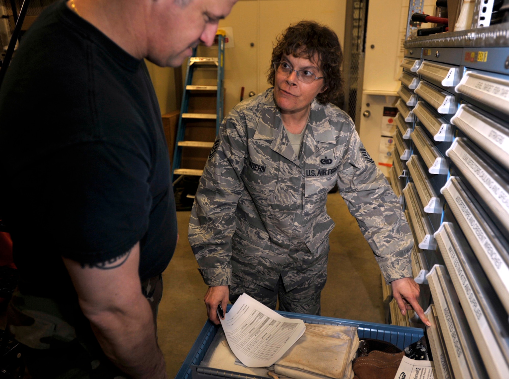 Tech. Sgt. Tina Koehn helps Tech. Sgt. Paul Raymer inventory supplies during the 931st Air Refueling Group's drill weekend in March. Both sergeants are assigned to the 931st Civil Engineer Squadron, where Sergeant Koehn is the supply noncommissioned-officer-in-charge. The month of March was designated Women's History Month to recognize the contributions of women like Sergeant Koehn. (U.S. Air Force photo/Tech. Sgt. Jason Schaap)